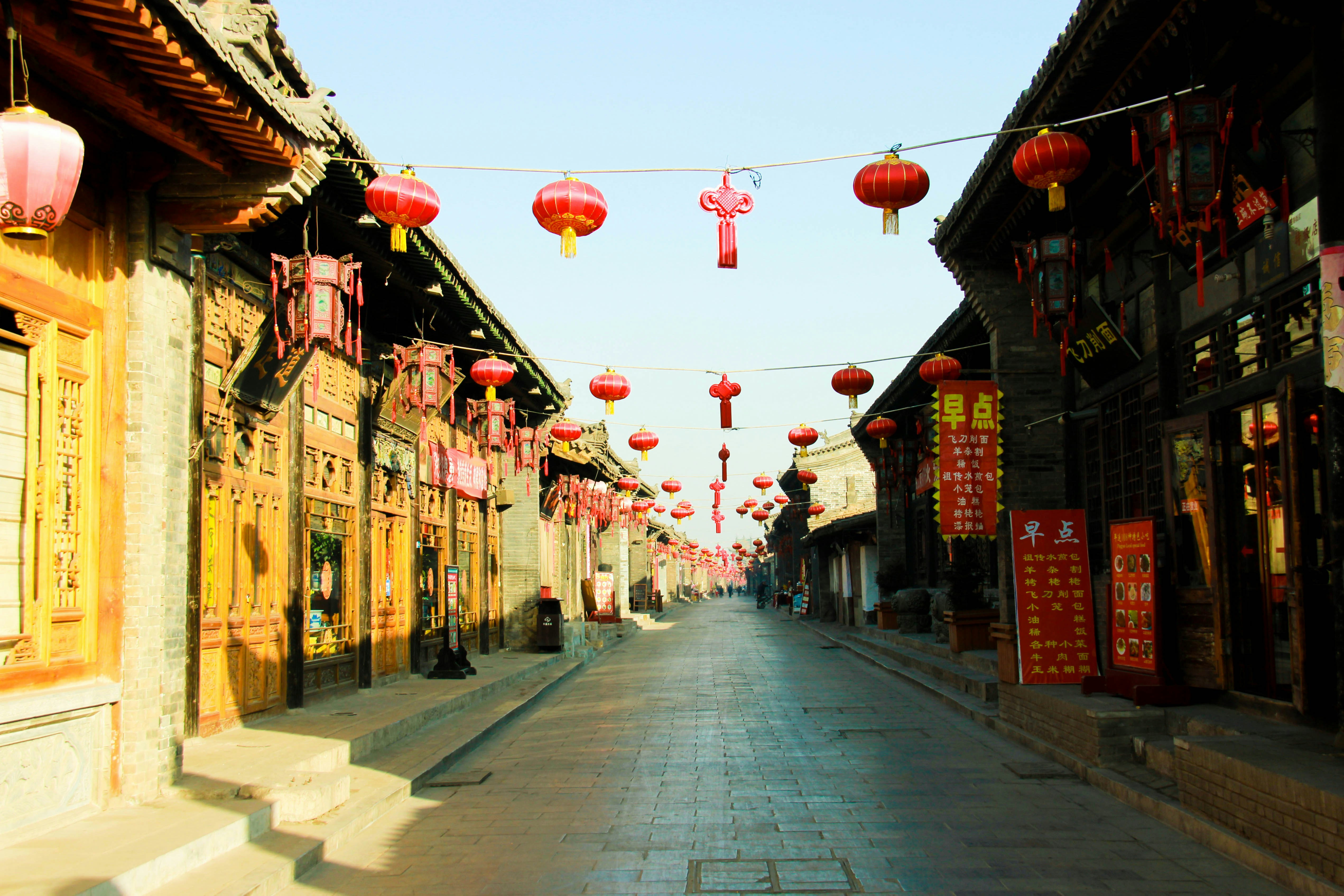 Traditional street lined with shops and red lanterns