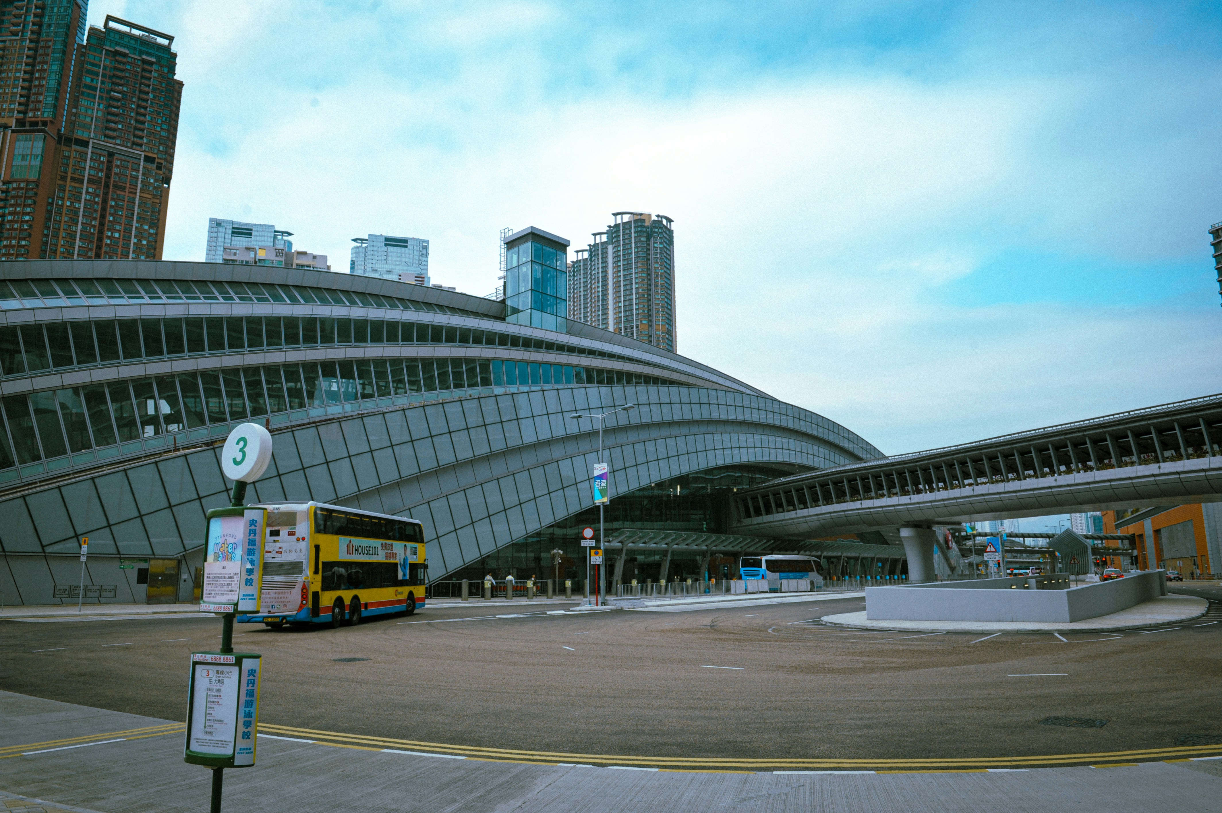 Modern transportation hub with buses and buildings.