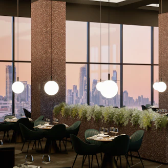Elegant restaurant interior with city view at sunset.