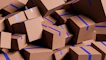 A large pile of brown cardboard boxes with blue tape.