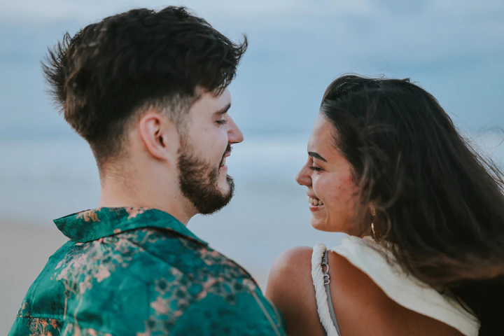 Couple looking at each other at the beach