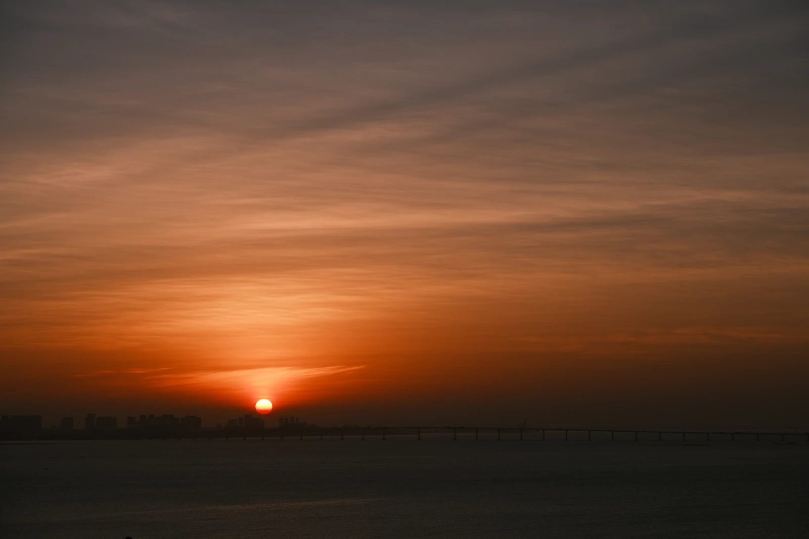 Sunrise over a calm ocean horizon