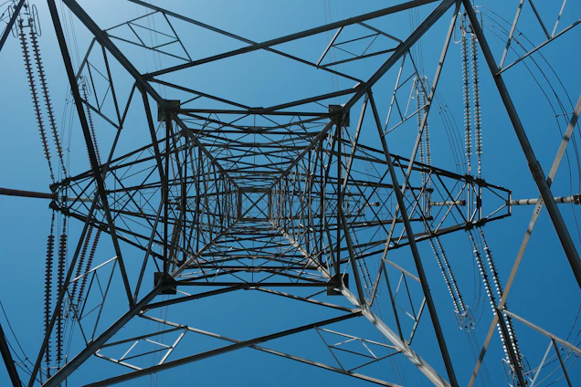 Looking up through a steel power line tower