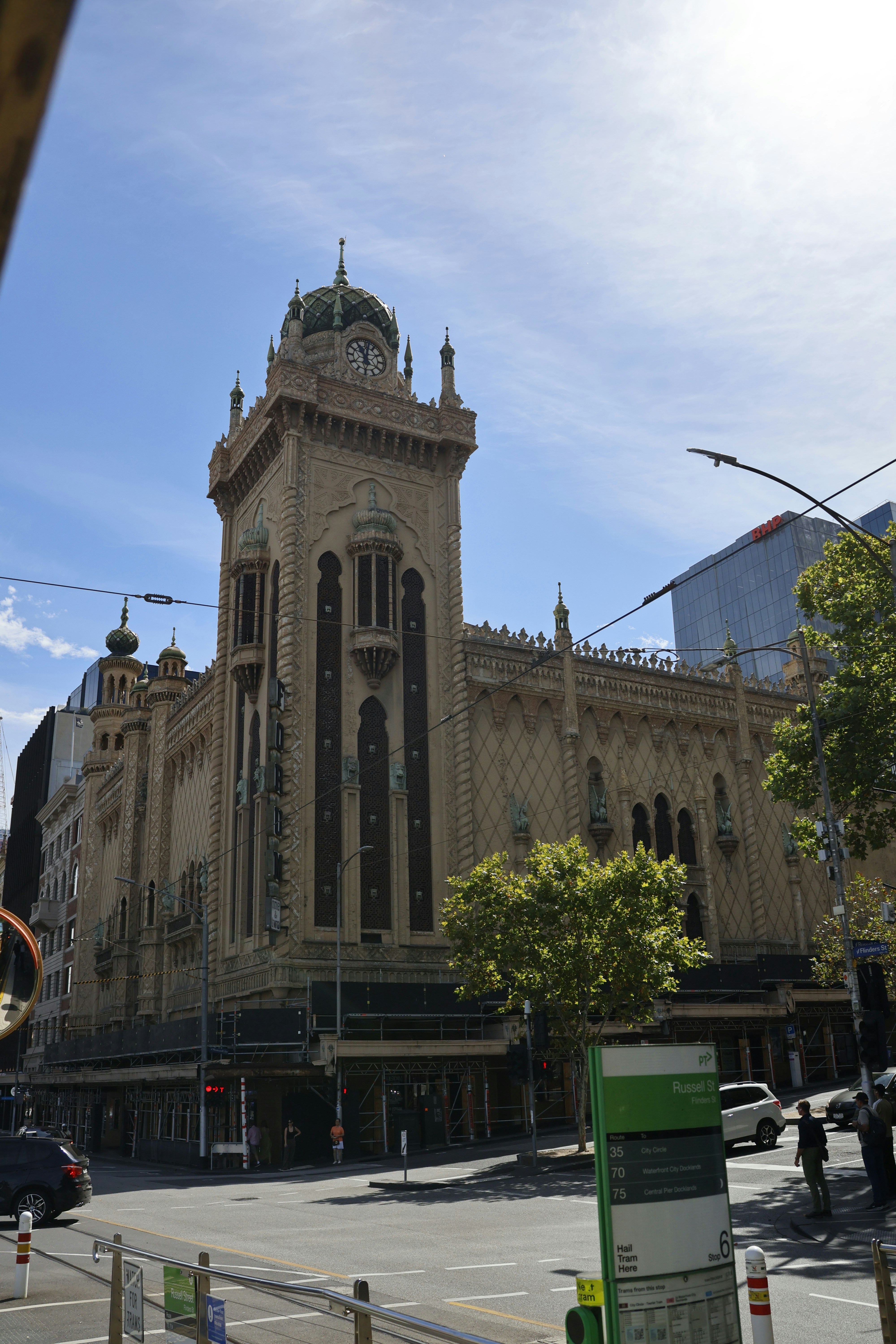 Ornate building with clock tower on sunny day