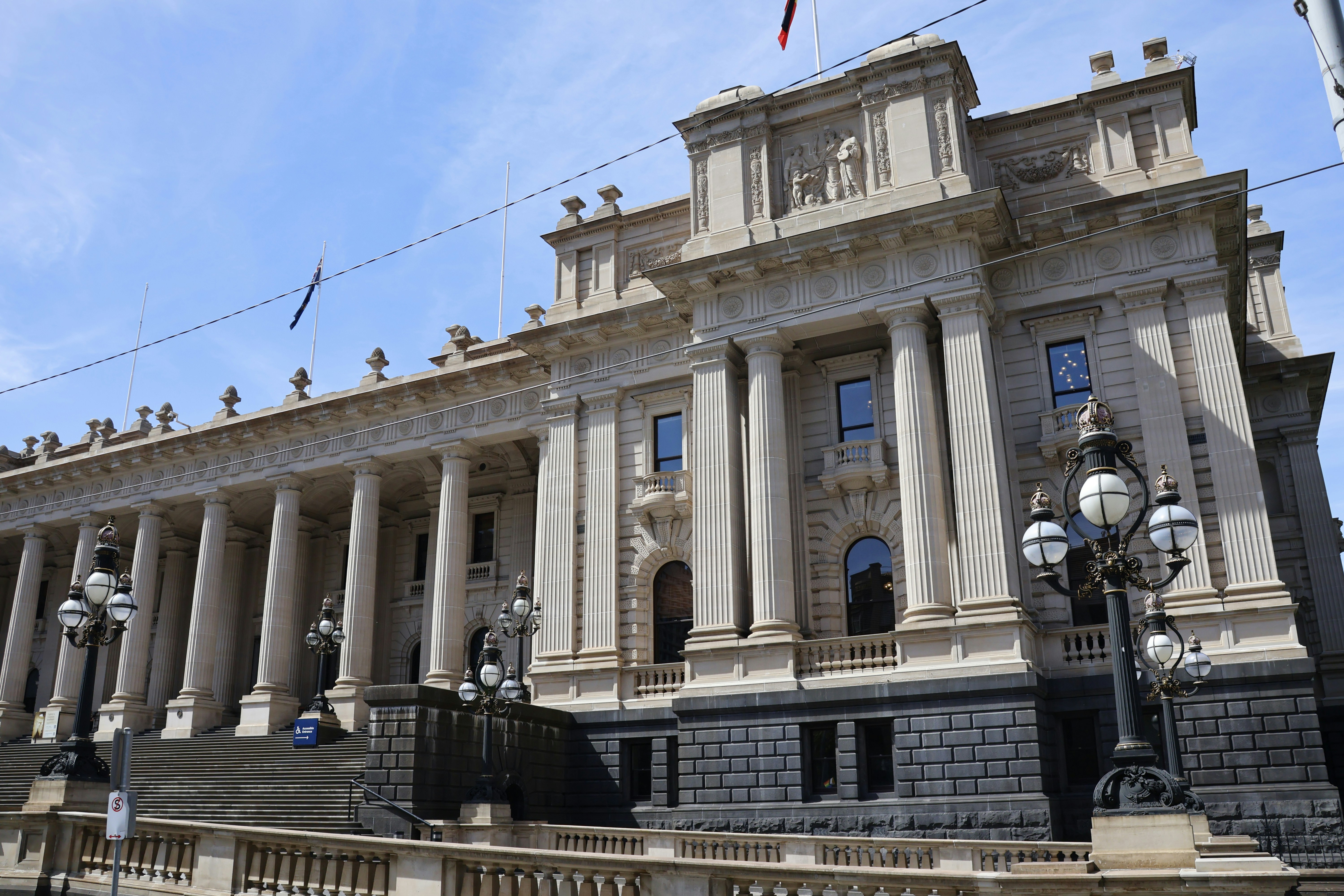 Grand neoclassical building with columns and ornate facade.
