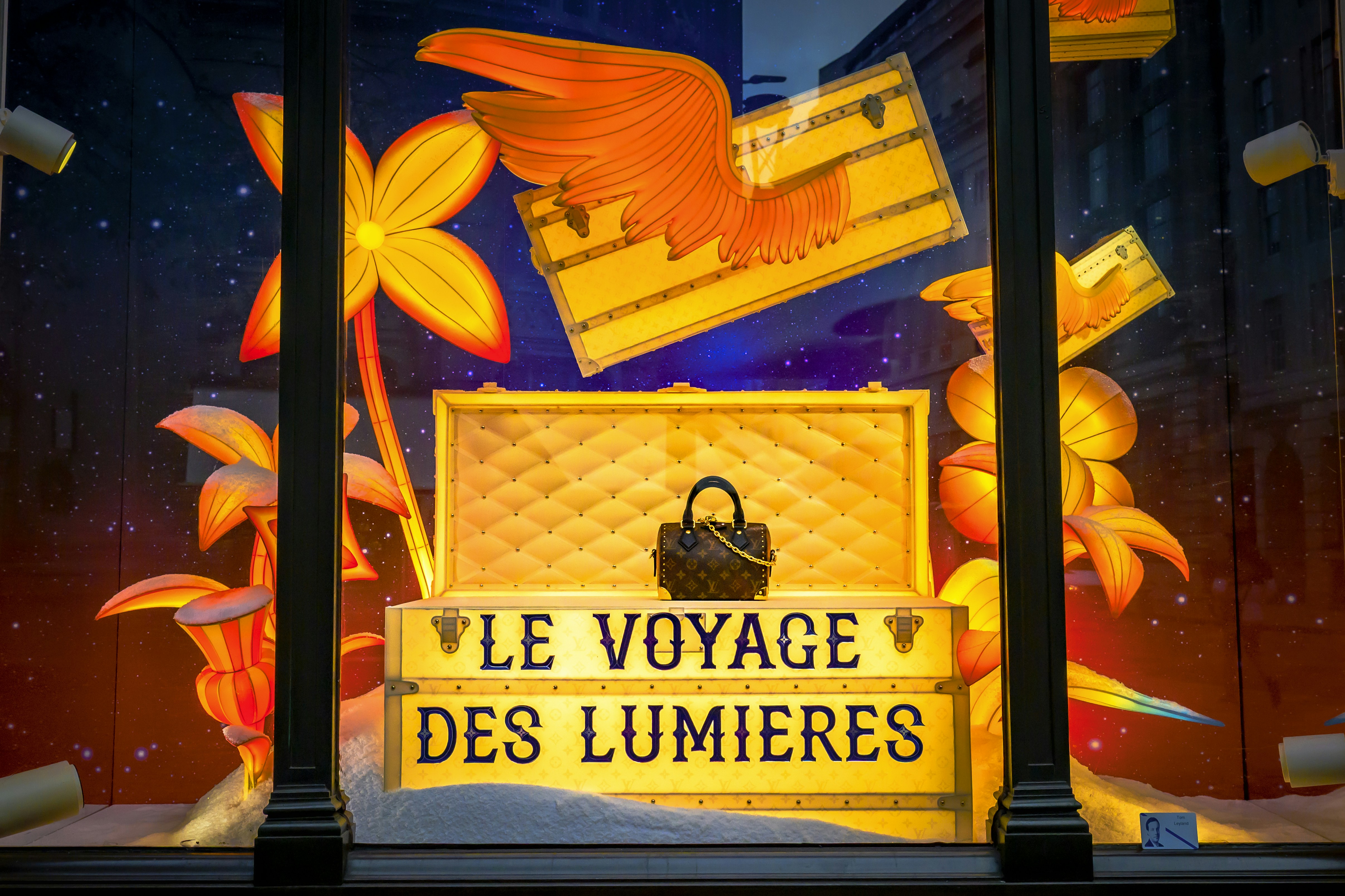 Louis vuitton display with "le voyage des lumieres" text.