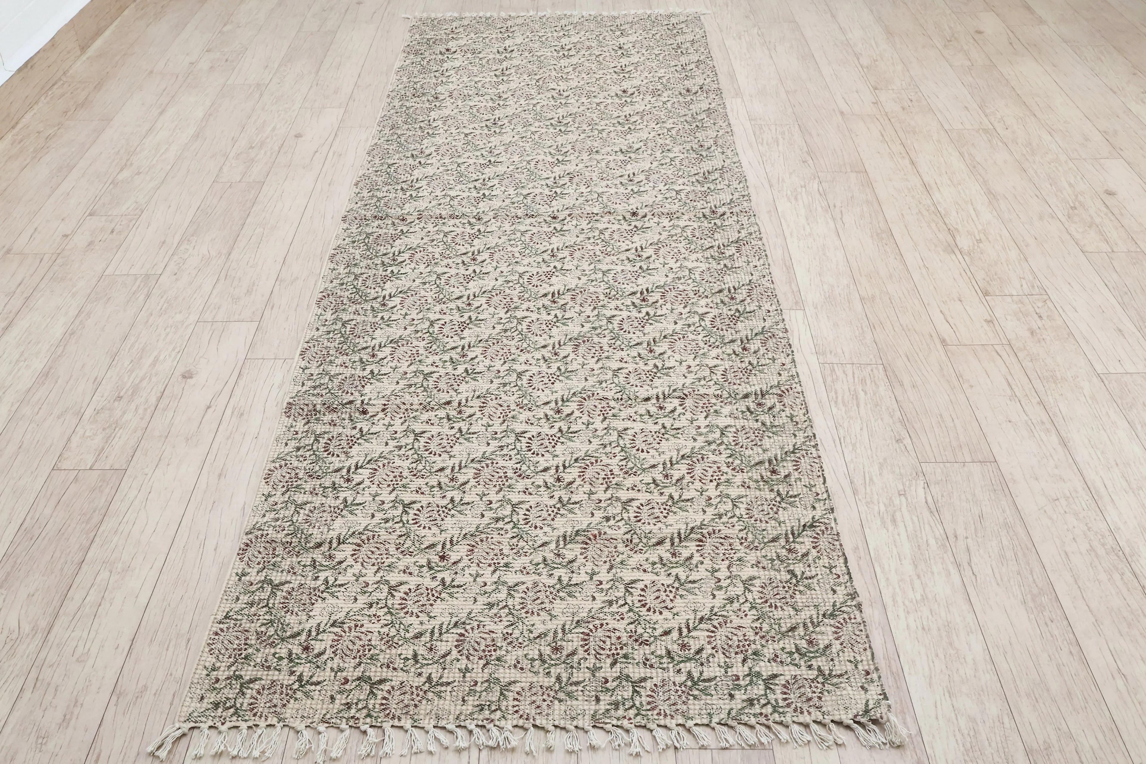 Oatmeal textured runner on a timber floor