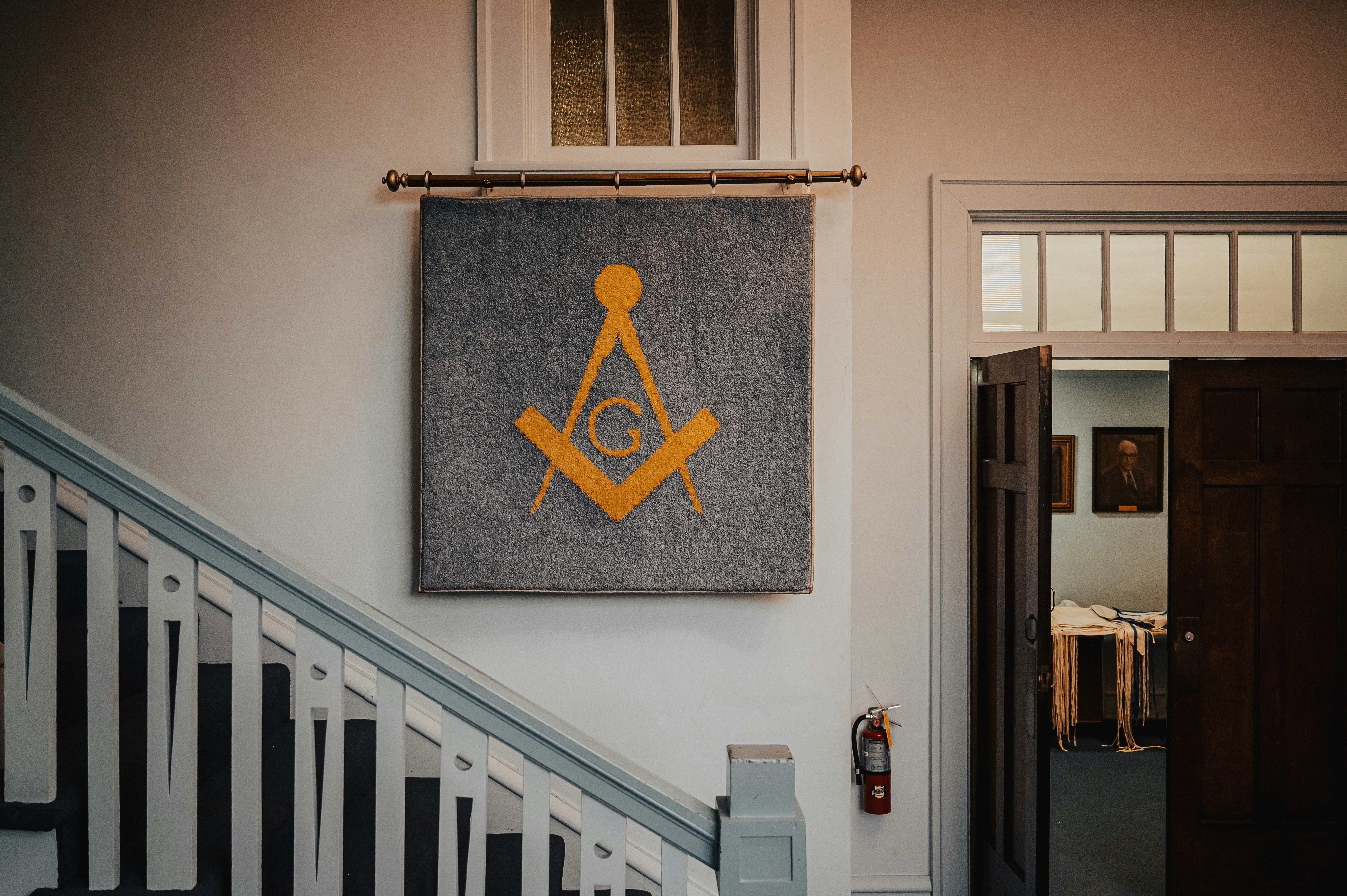 Masonic symbol banner hanging on wall