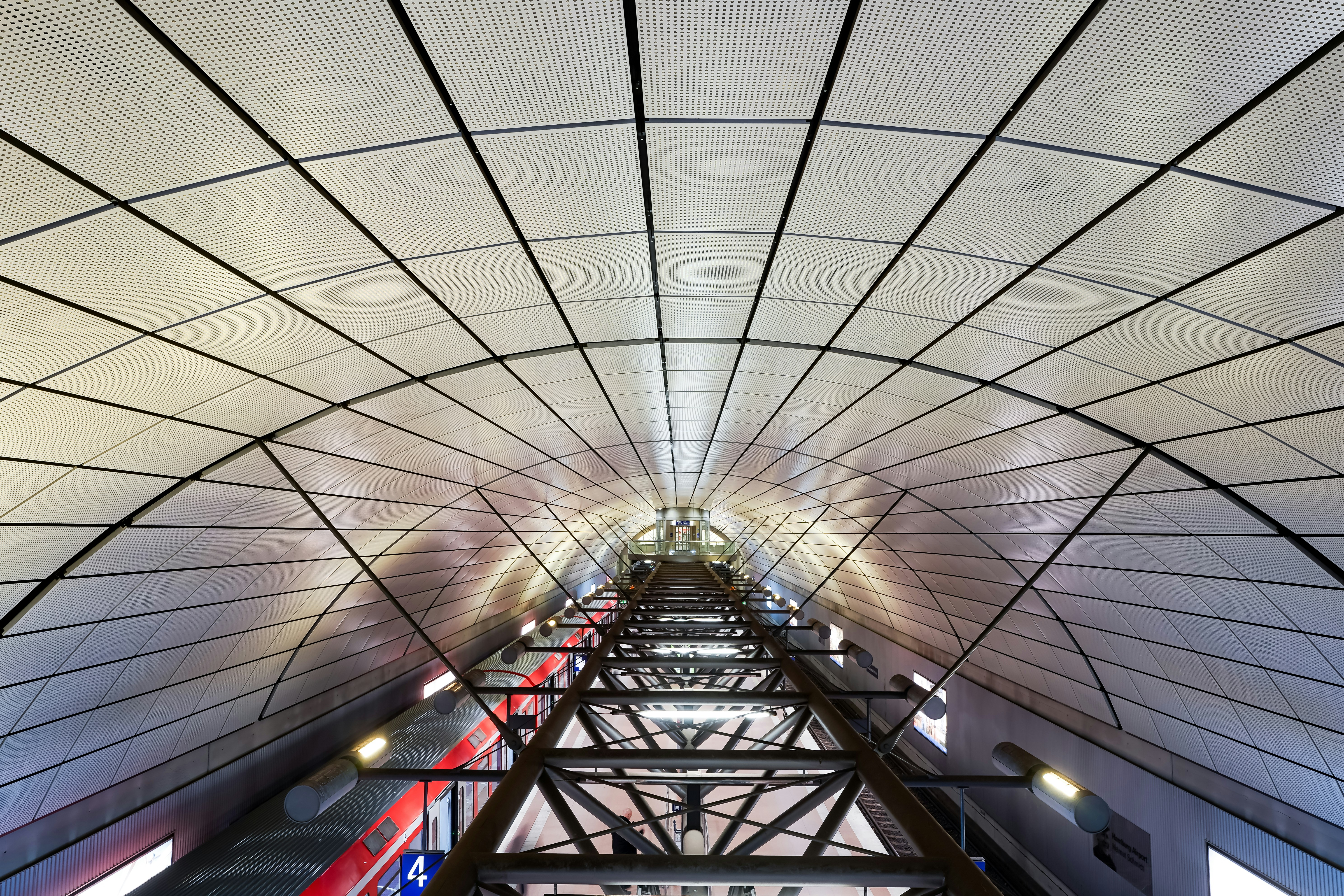 Modern tunnel with a curved ceiling and train tracks