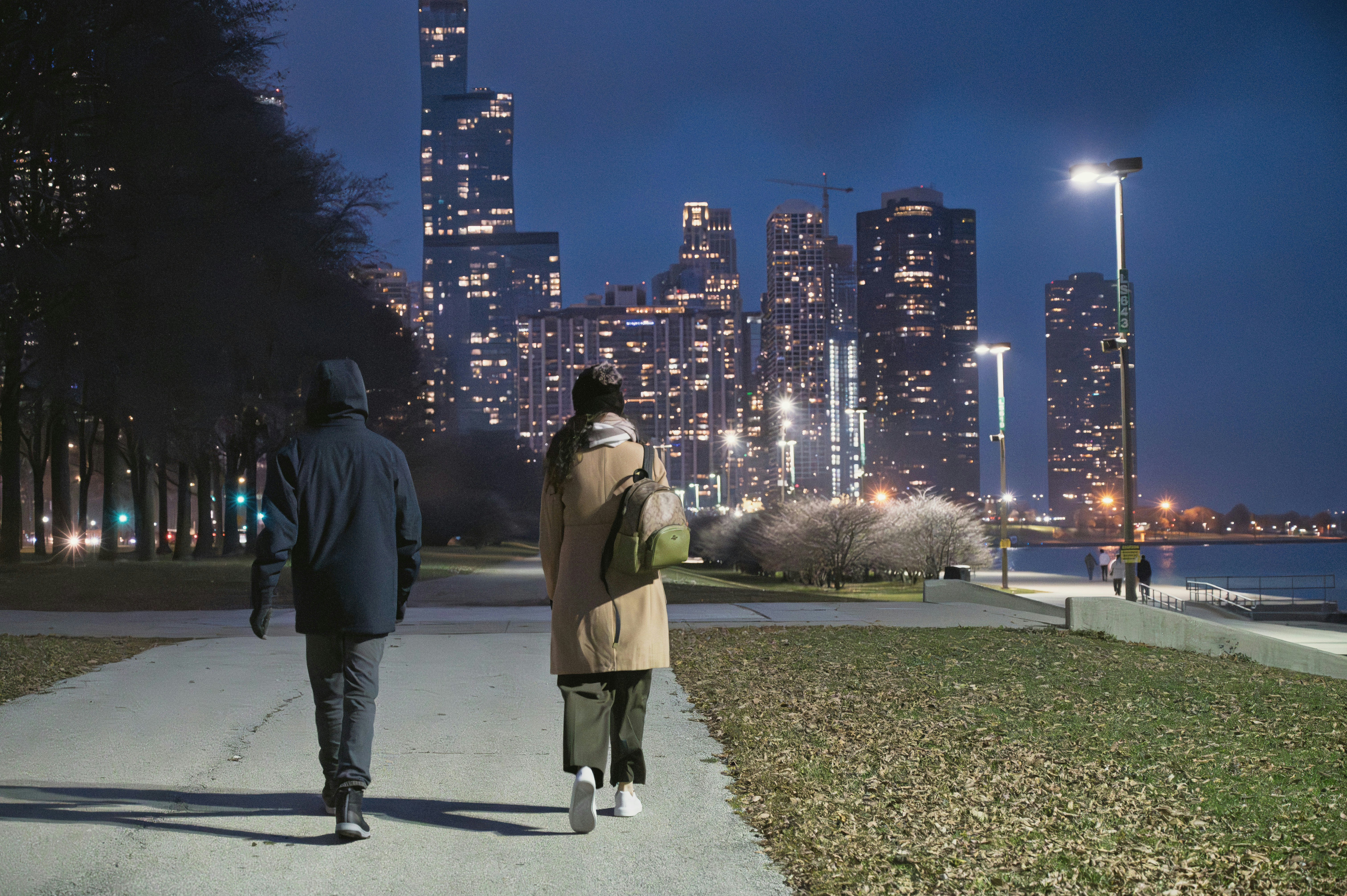 A couple walking together outdoors in the evening, a shared movement that can shift the texture of an ordinary week in a relationship