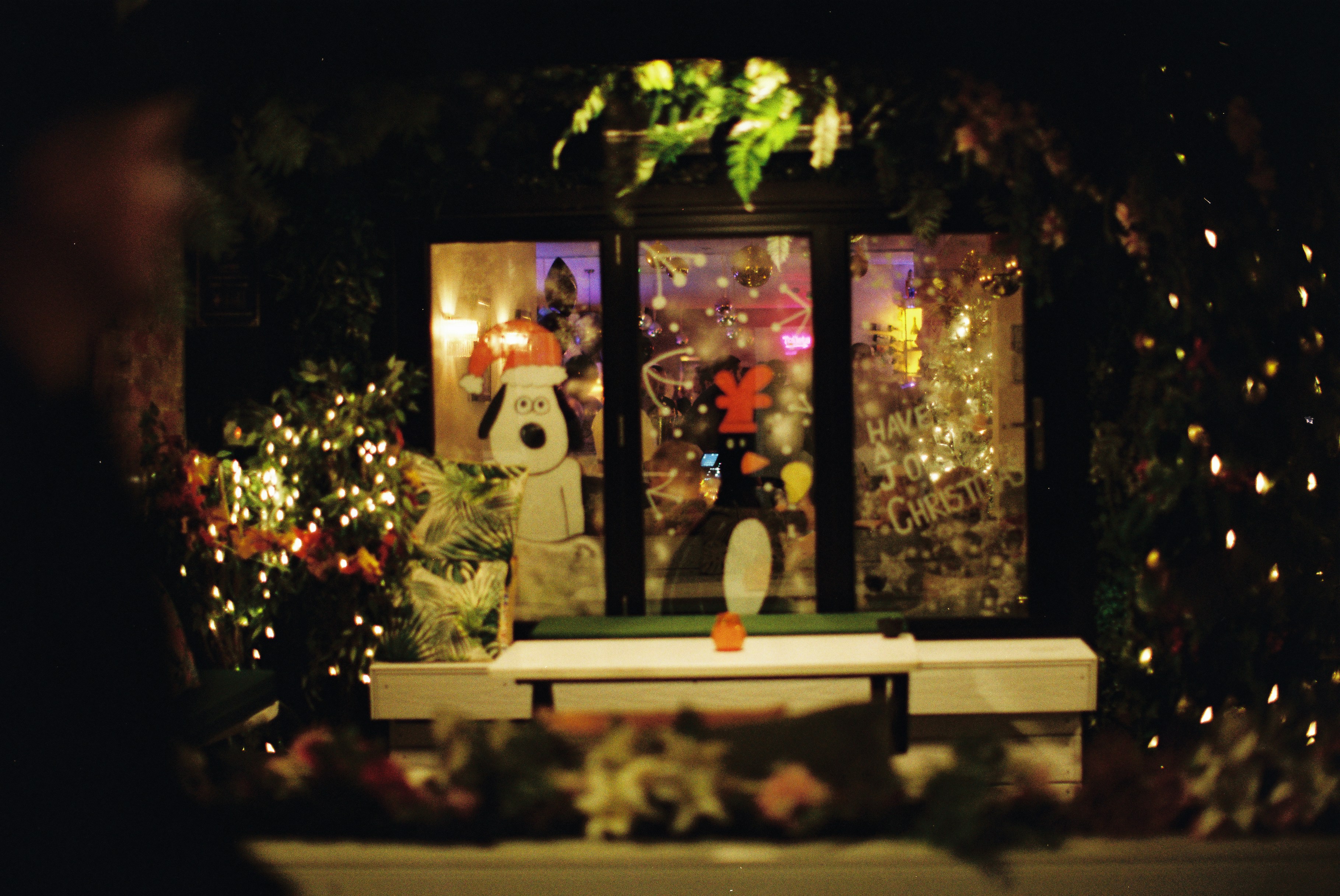Christmas display with snoopy and a penguin