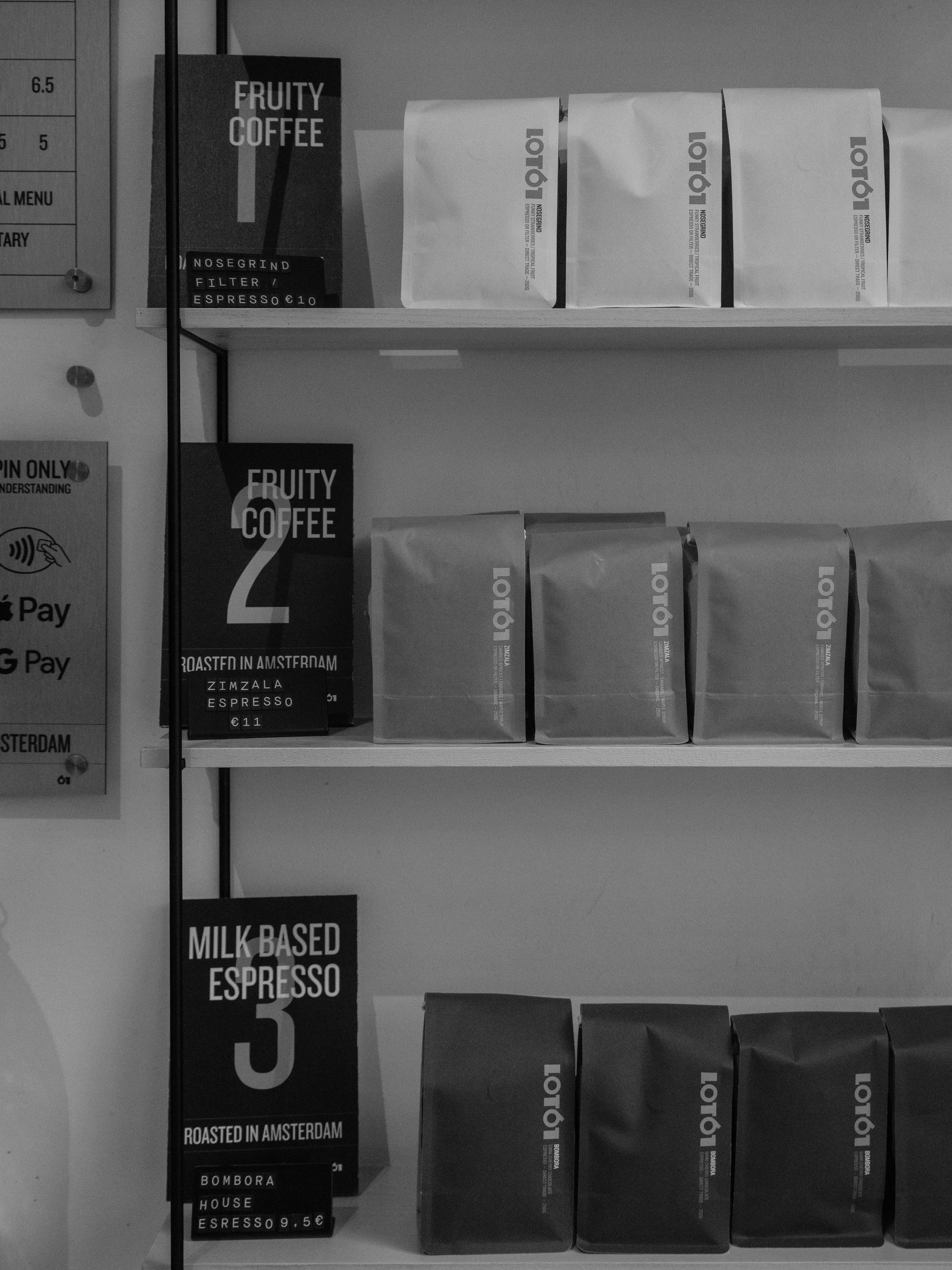 Bags of coffee beans displayed on shelves.