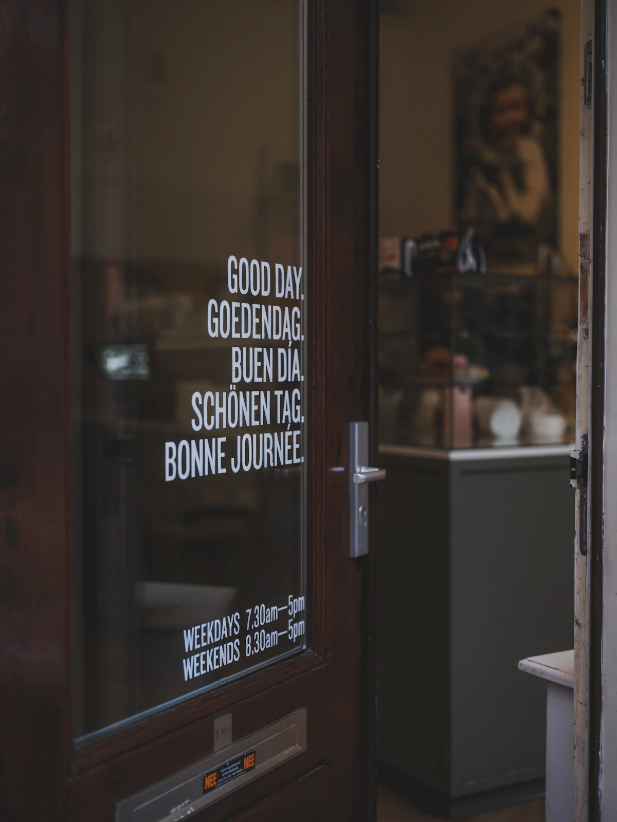 Shop door with opening hours