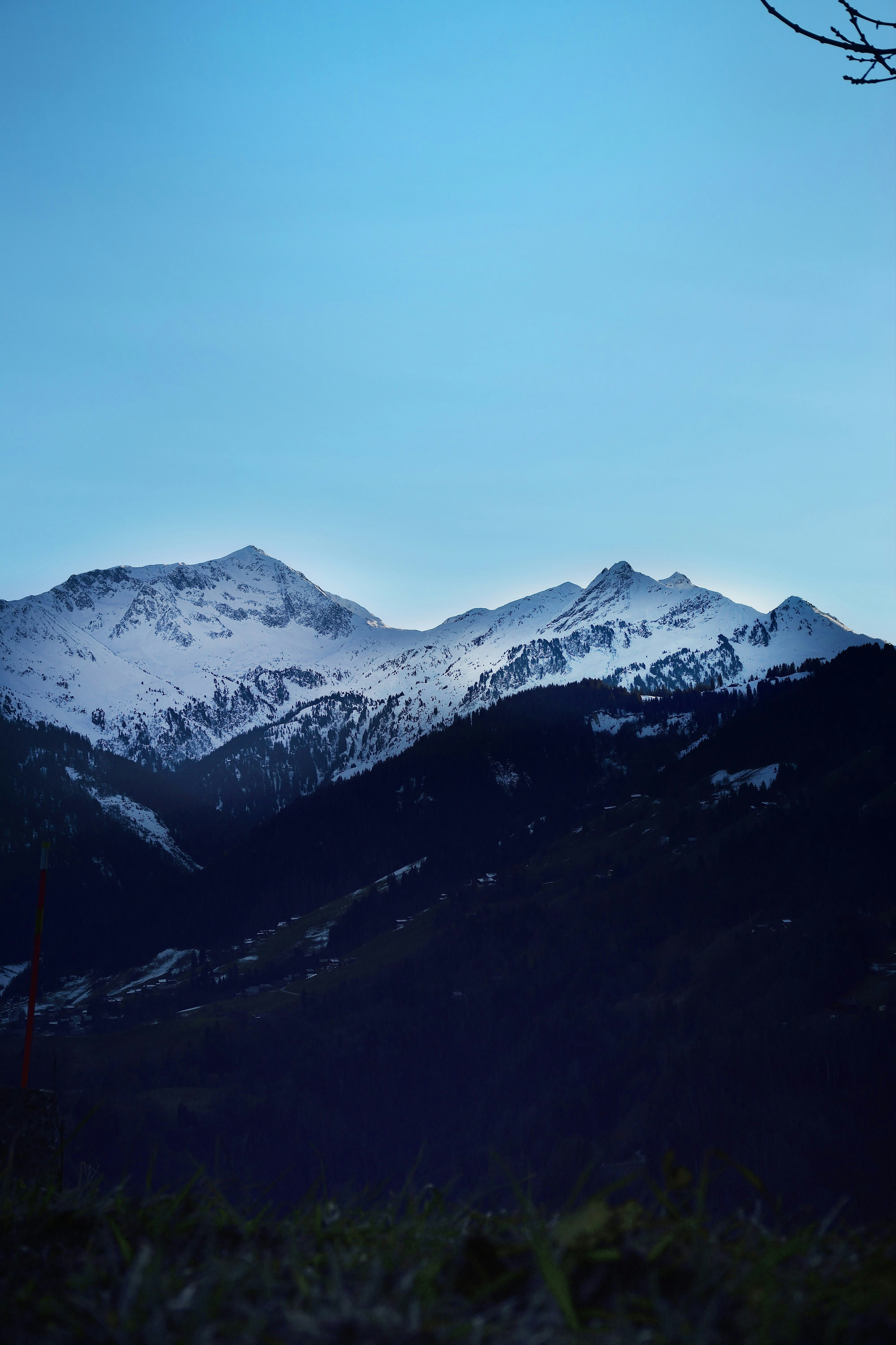 Snow-capped mountains under a clear blue sky.