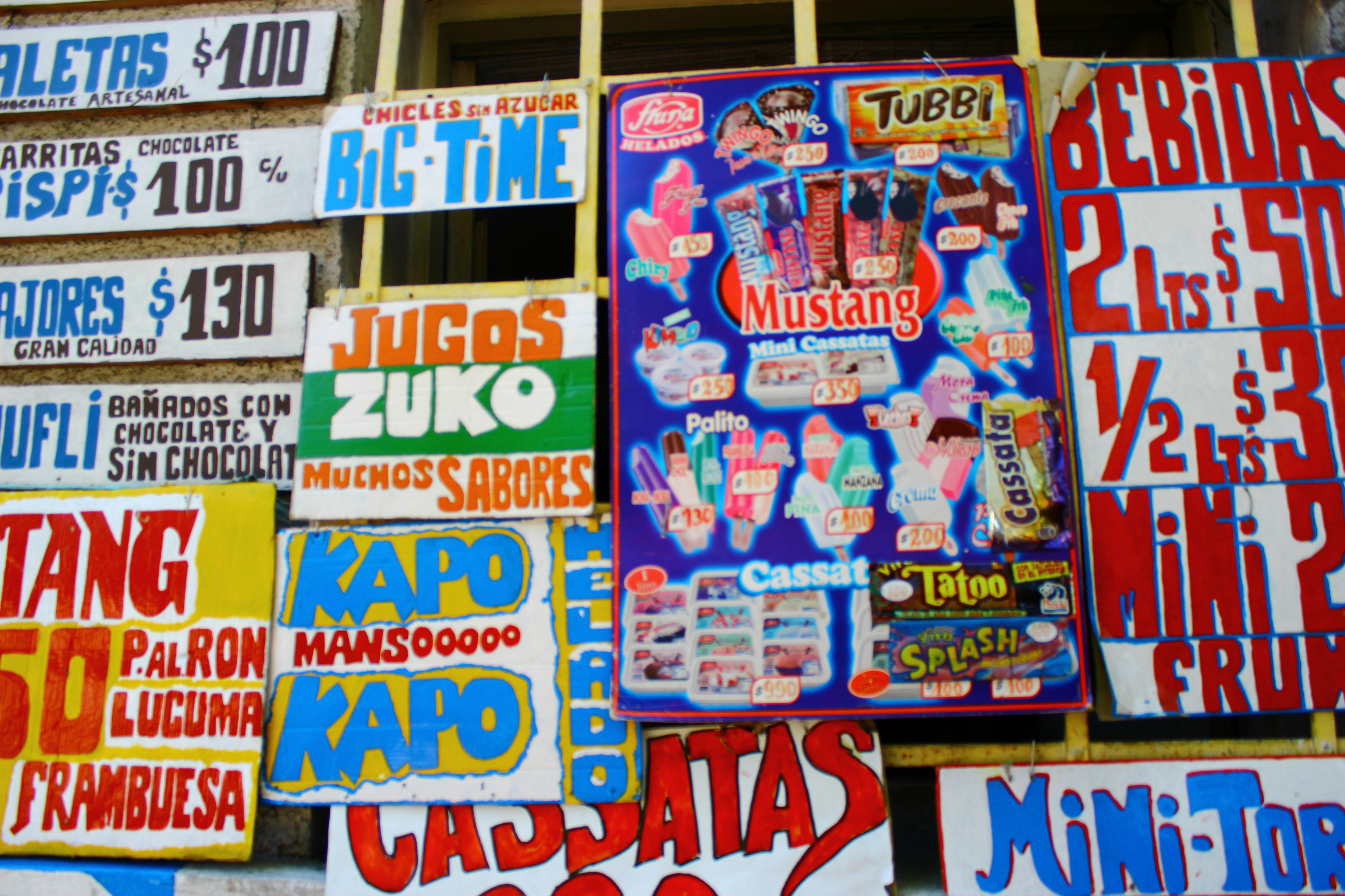 Colorful signs advertise ice cream and drinks.