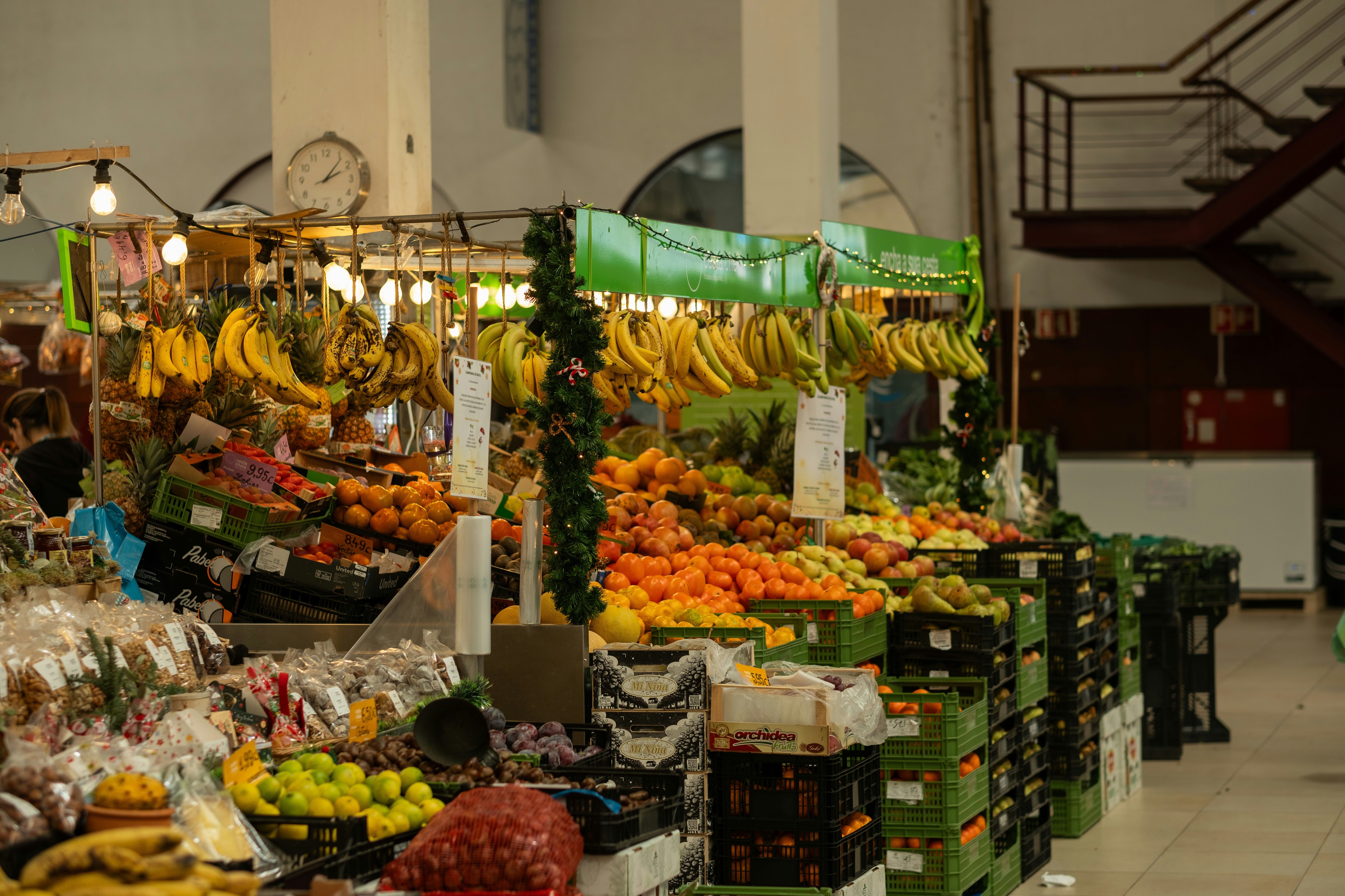Fresh fruit and vegetables displayed at market stalls