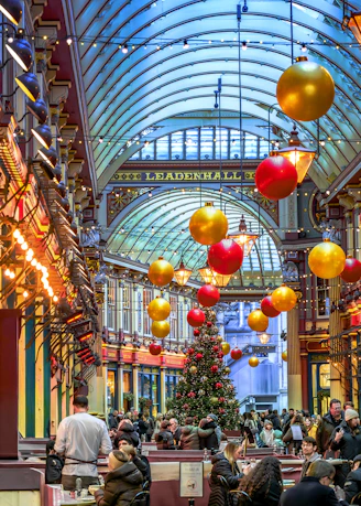 Christmas decorations adorn a bustling market hall