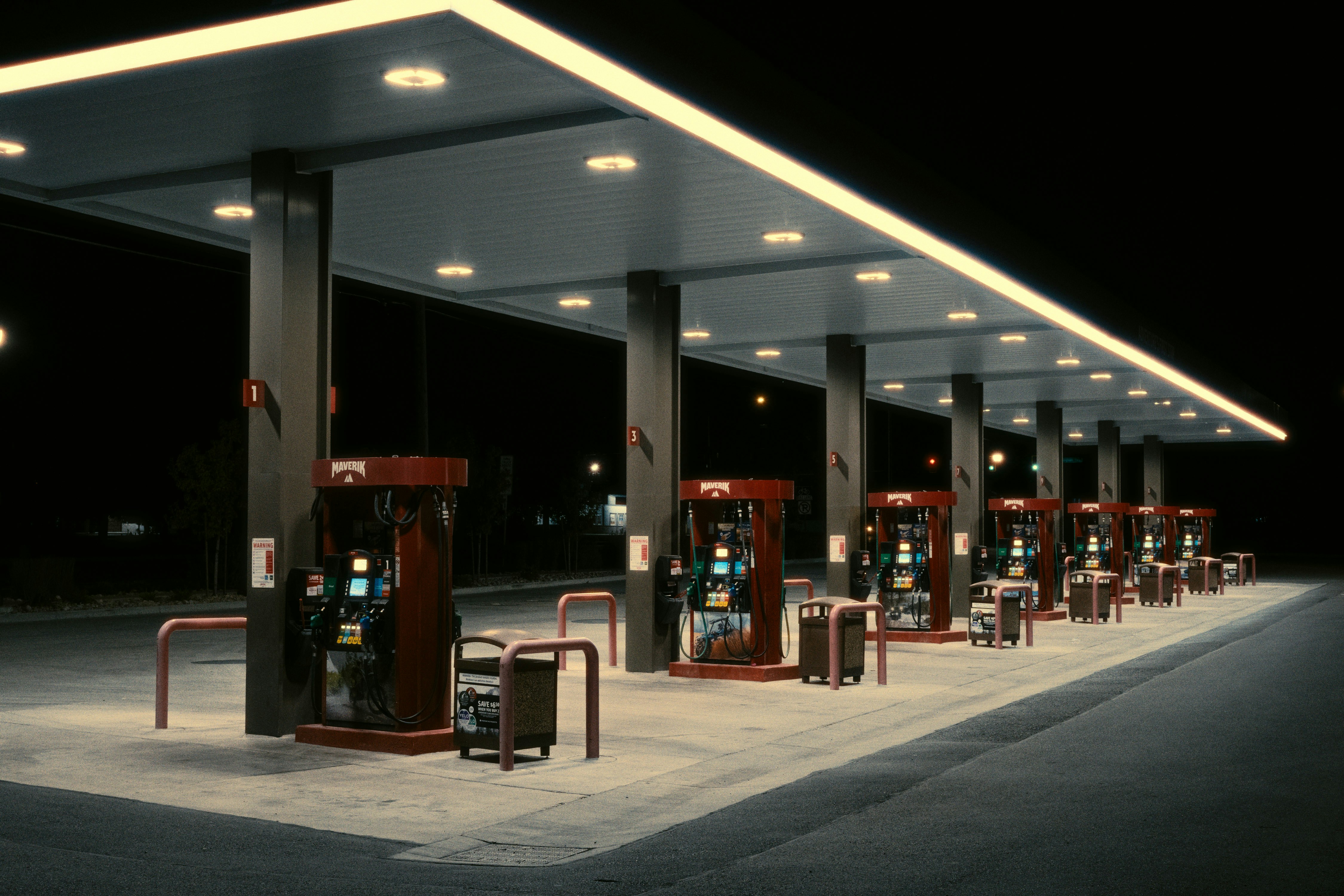 Illuminated gas pumps at night