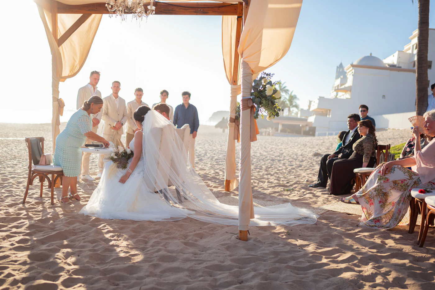 Beach wedding permit requirements in Florida — Couple exchanging vows under a floral arch on a Florida beach