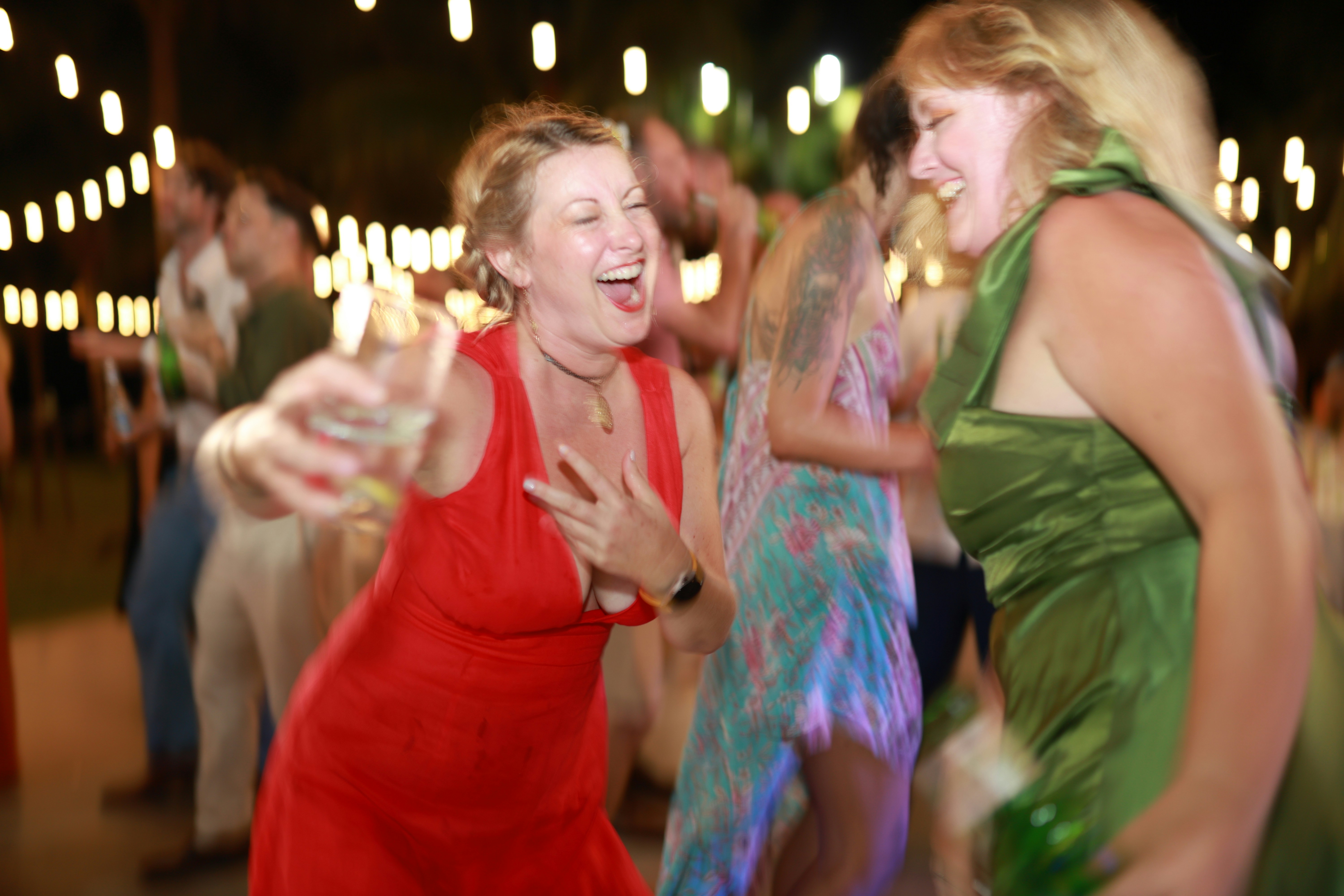 Women dancing and laughing at a party