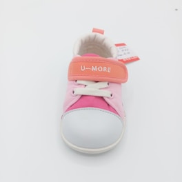 A pink and orange child's shoe with laces.