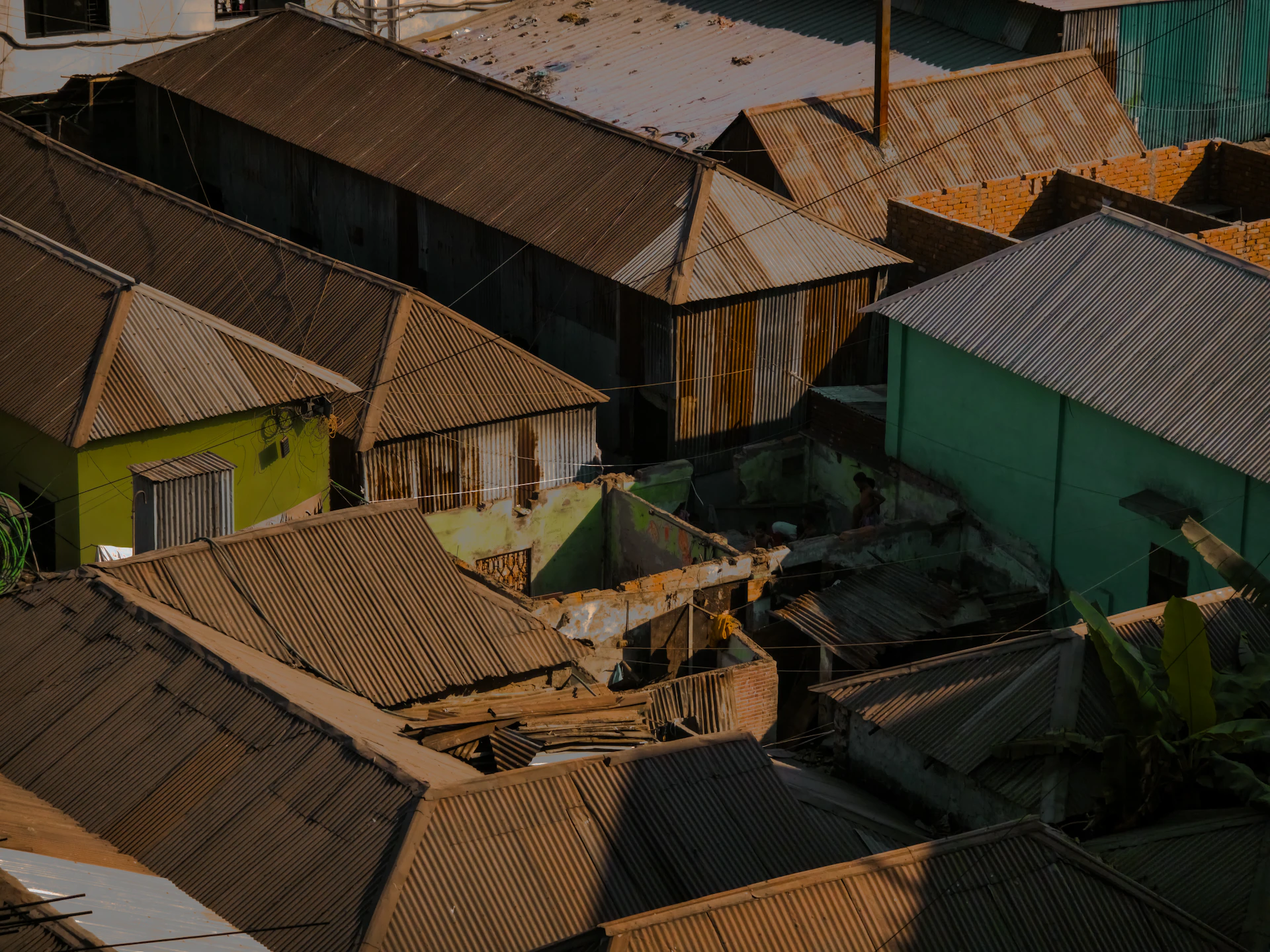 Roofs of weathered buildings in a densely populated area.