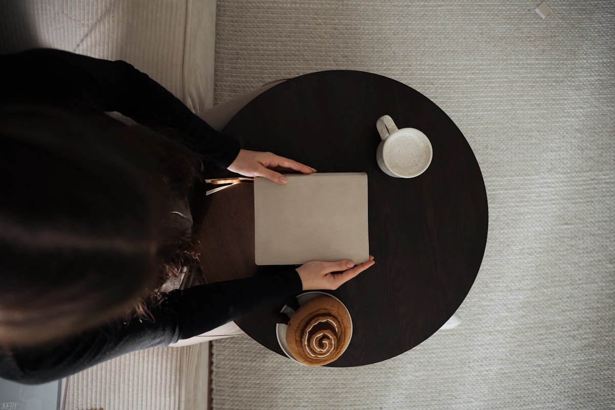 Notebook and coffee on a cafe table