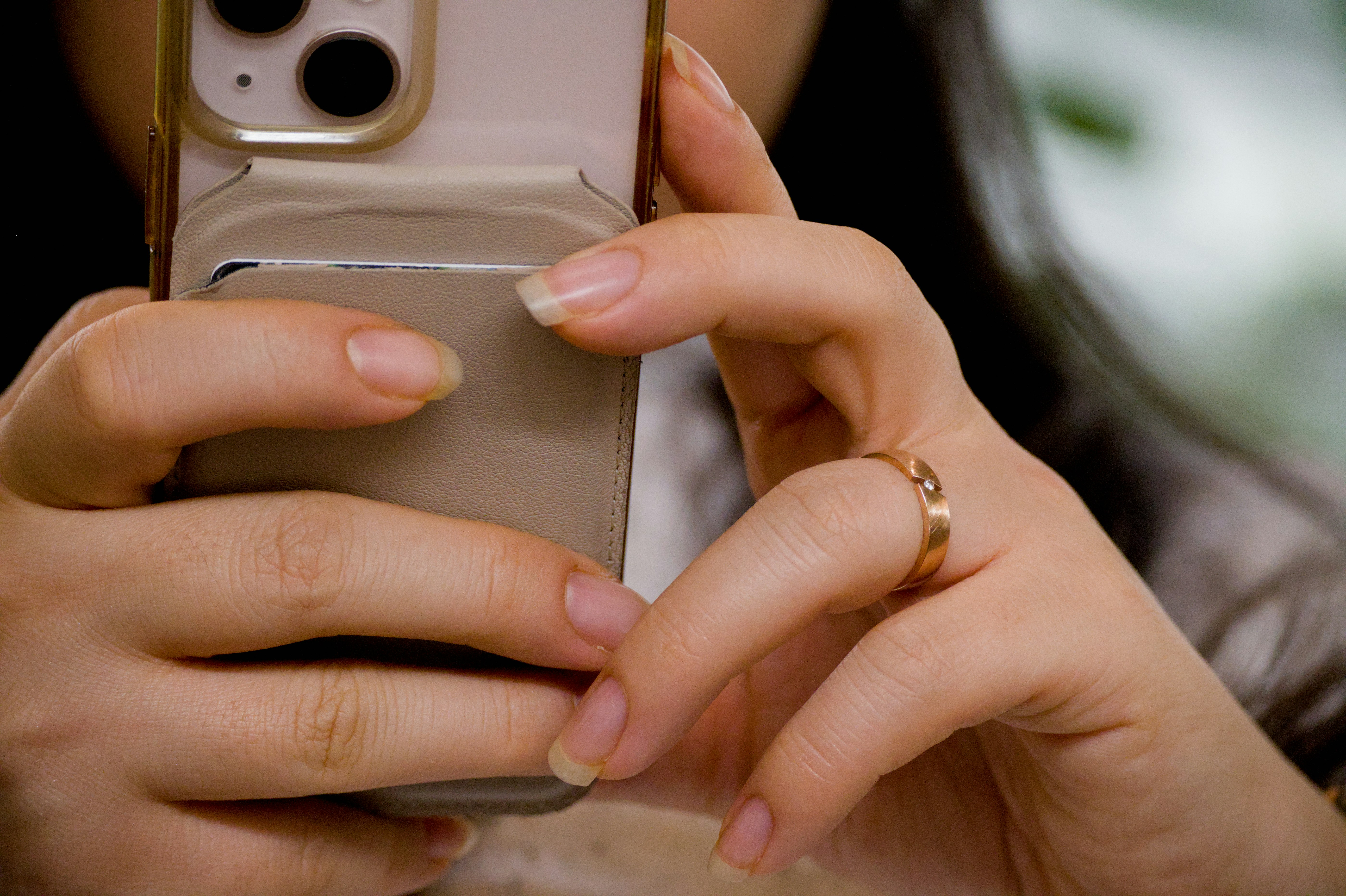 Close-up hands swiping on phone screen game - Woman's hands holding a smartphone