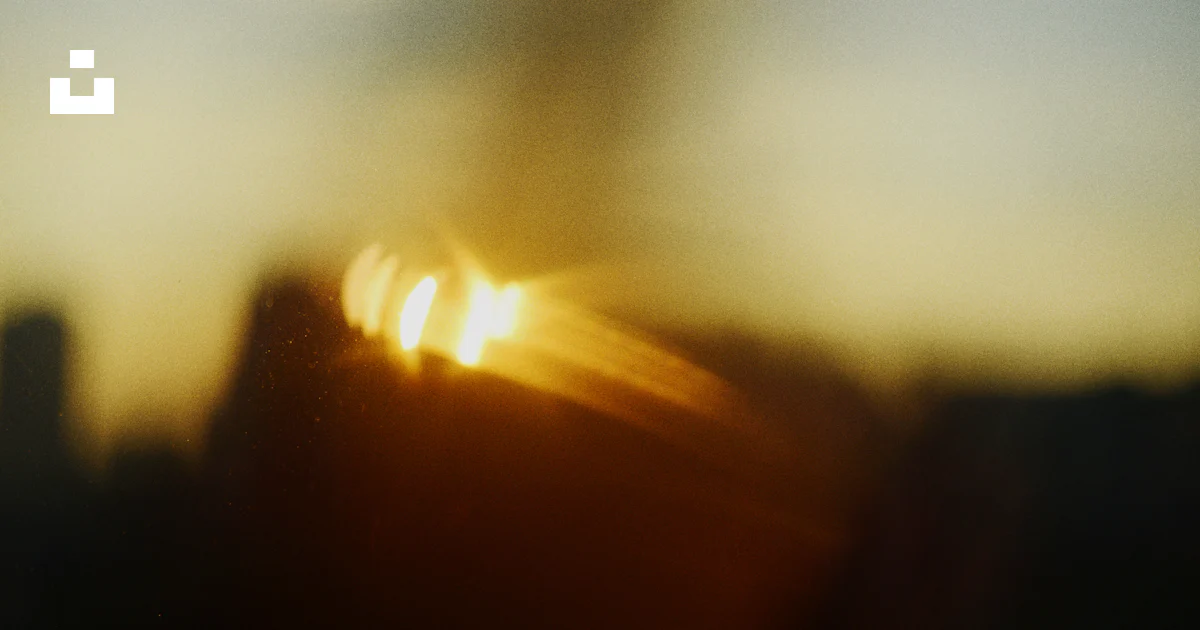 Unsplash Light Rays Blurred sunset with light rays over dark landscape. photo – Free ...