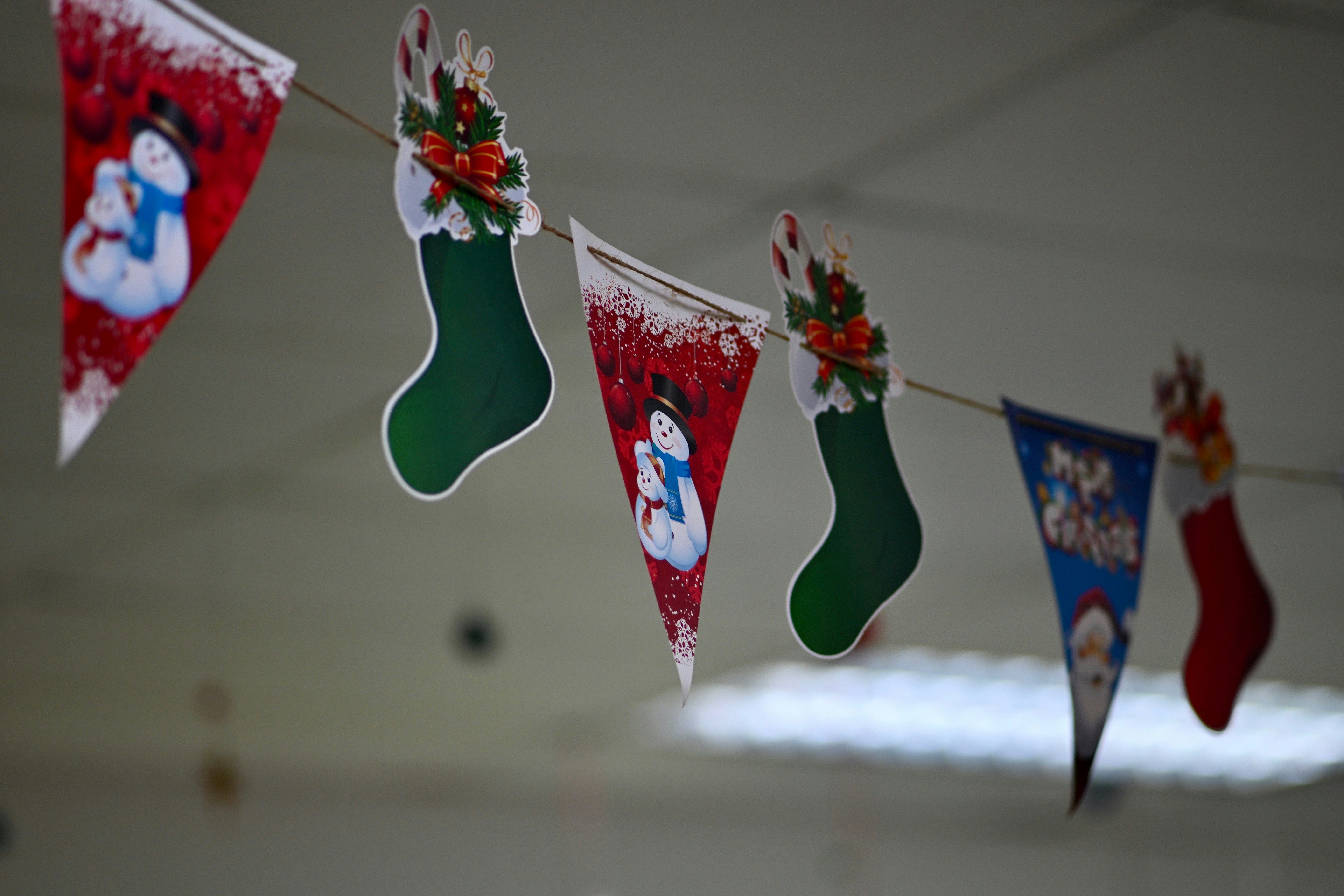 Christmas stockings and snowman decorations hanging