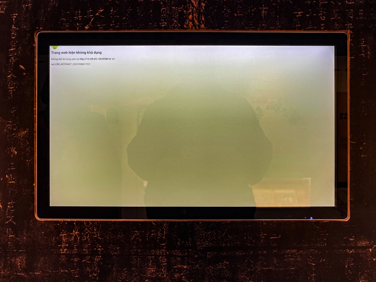 A computer screen shows a hazy green display.