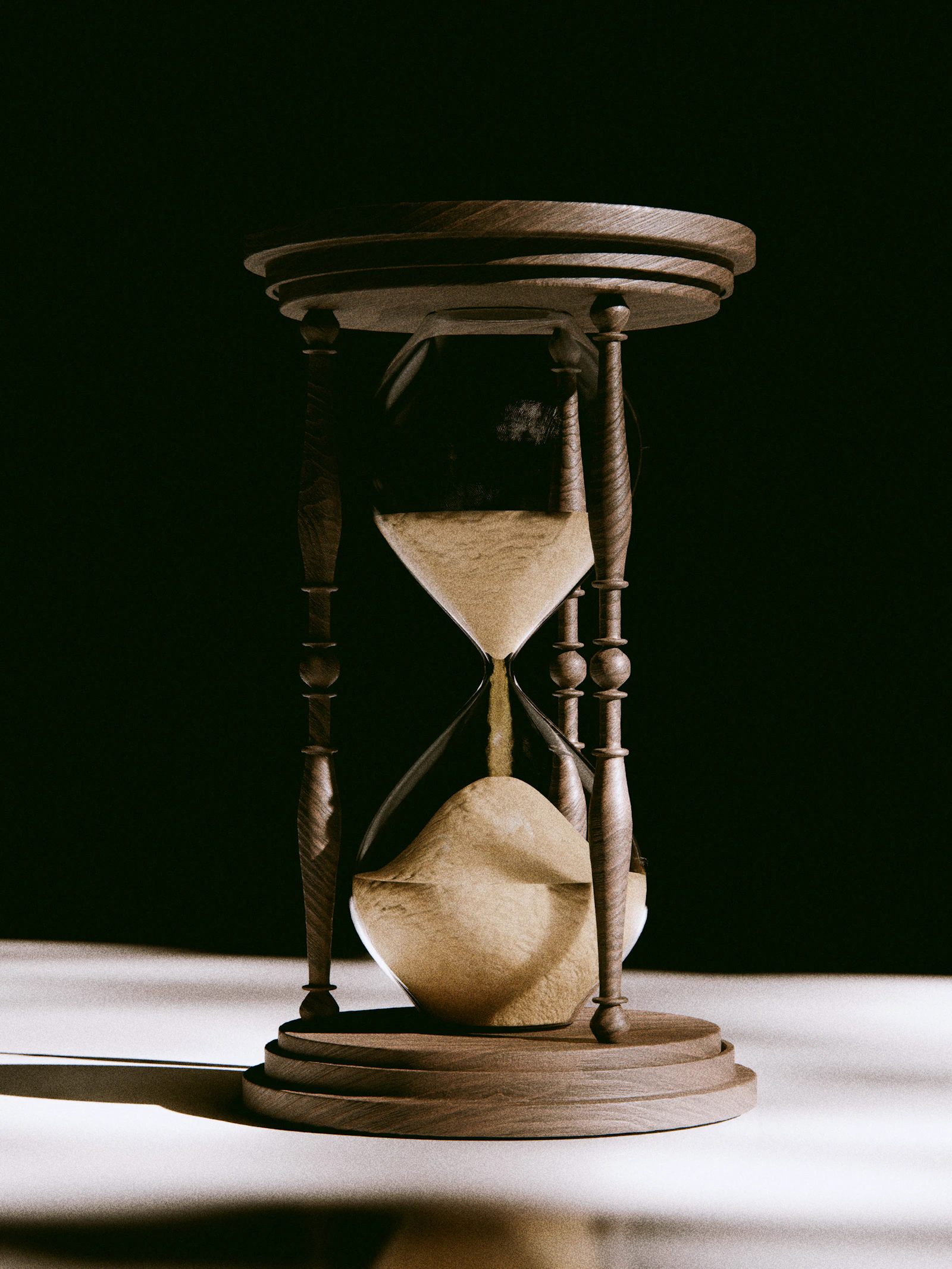 An antique hourglass with sand flowing through it