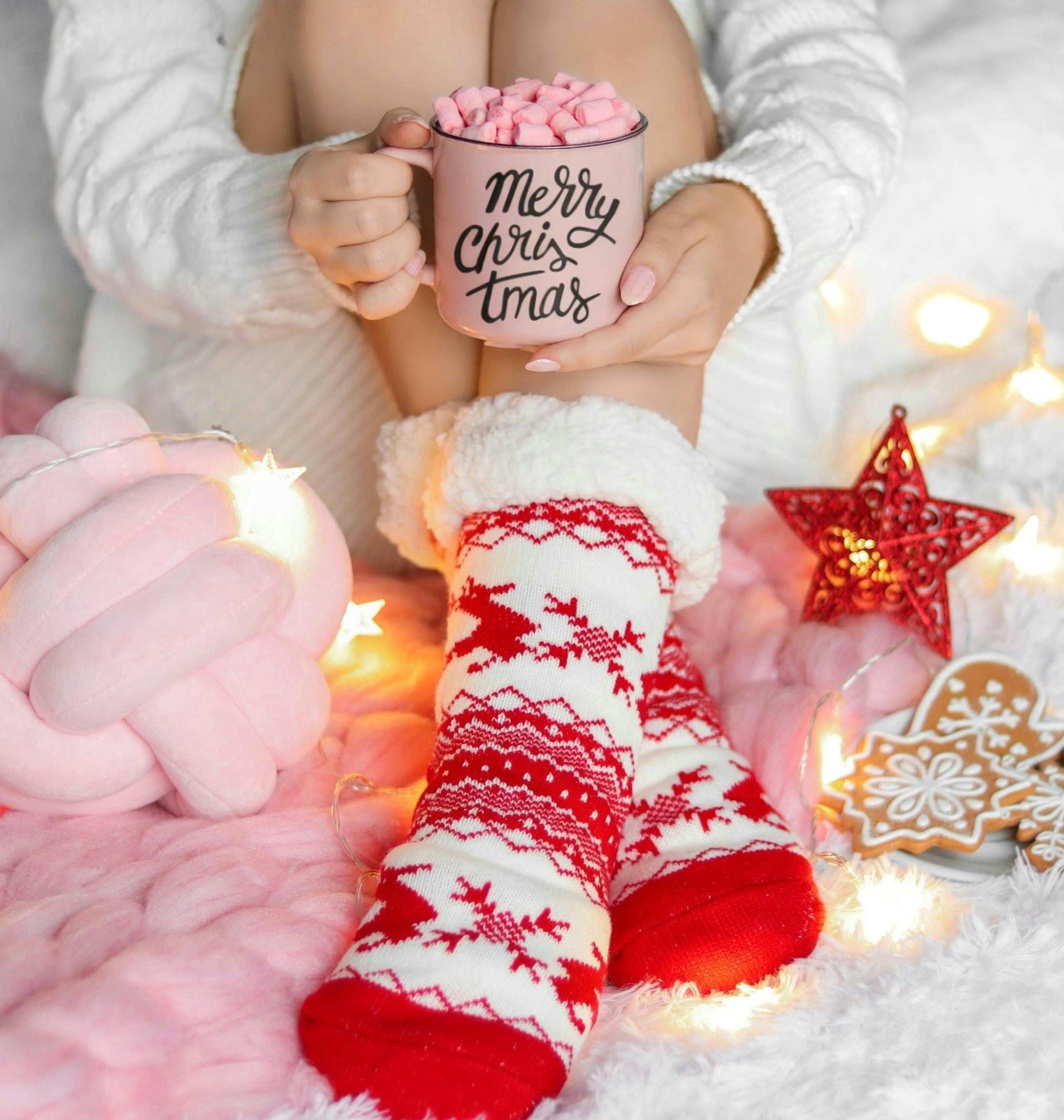 Cozy christmas scene with hot chocolate and festive socks
