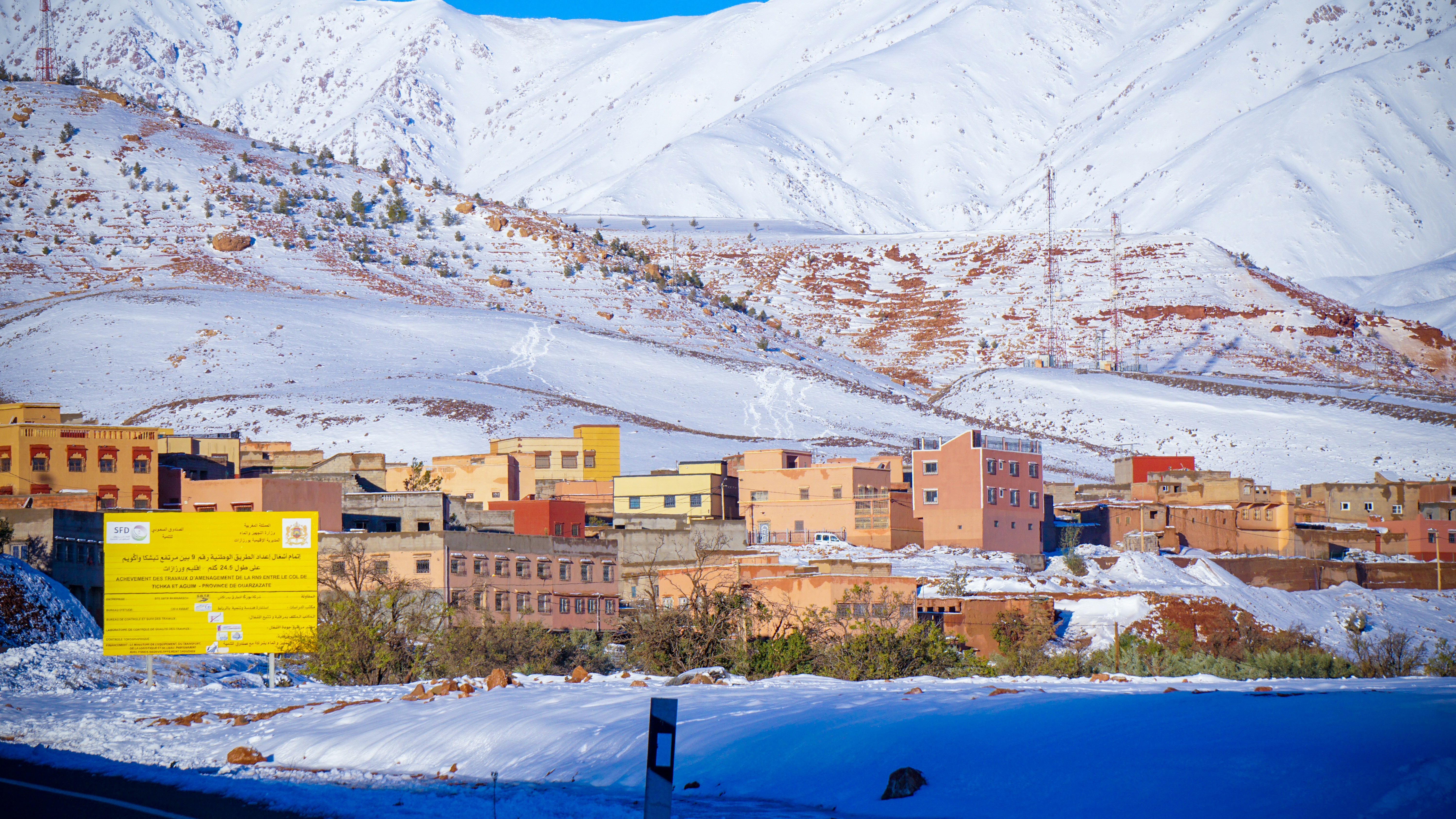 Snow-covered village nestled in the mountains