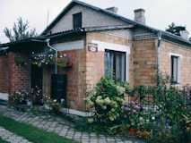 A small brick house with a garden and garden