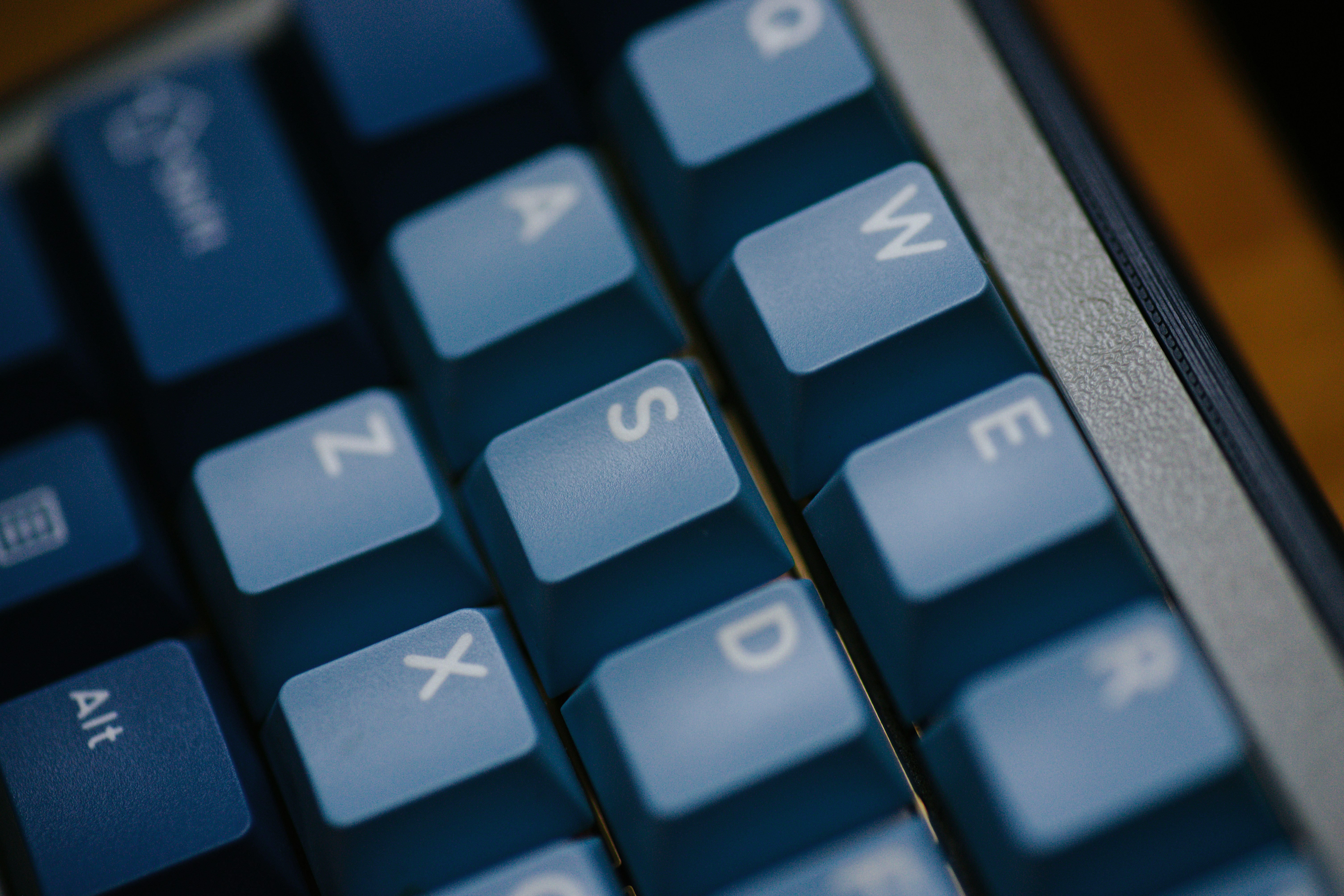 Close-up of blue keyboard keys with letters visible