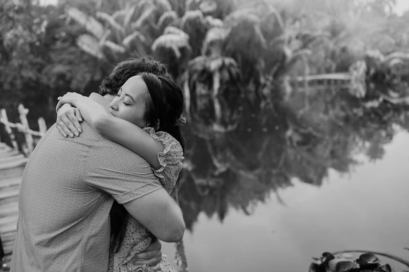 HSV-positive couple embracing by a lake