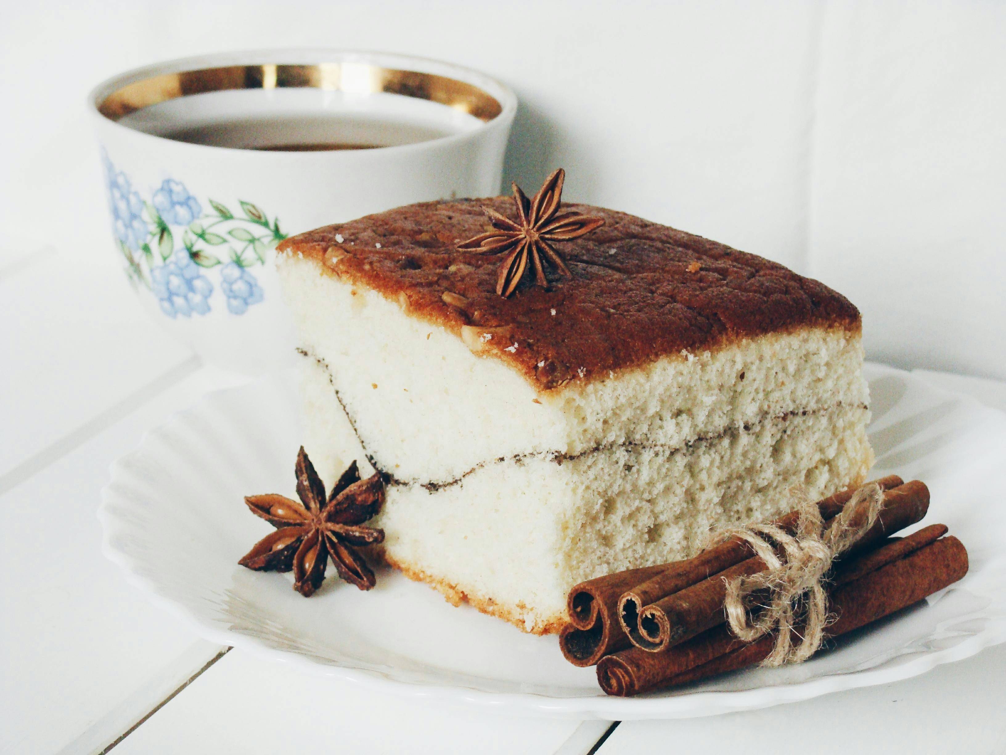 Slice of cake with cinnamon sticks and star anise