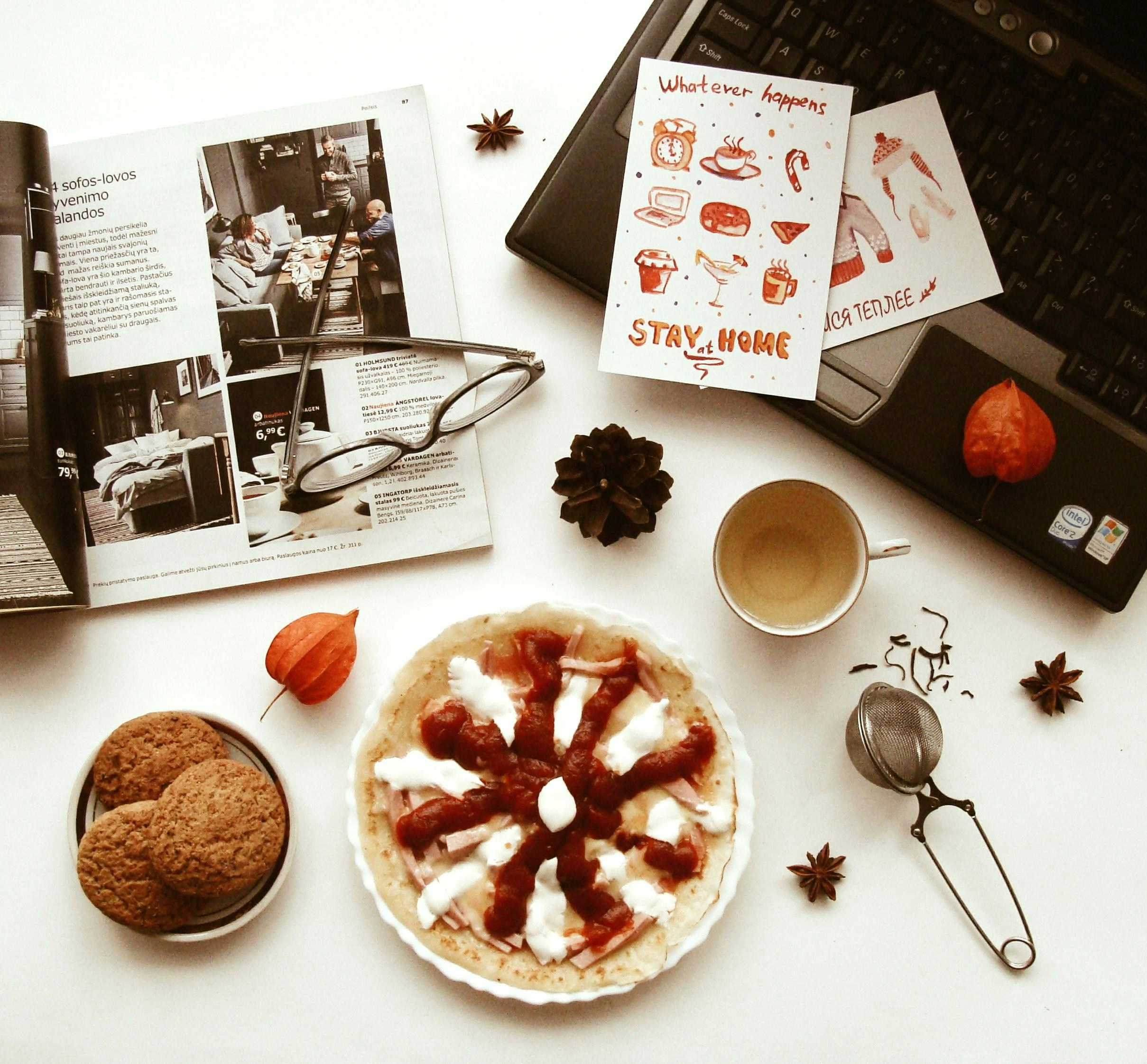 A pie, cookies, and coffee on a table.