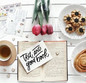Tea and good book with tulips and cookies