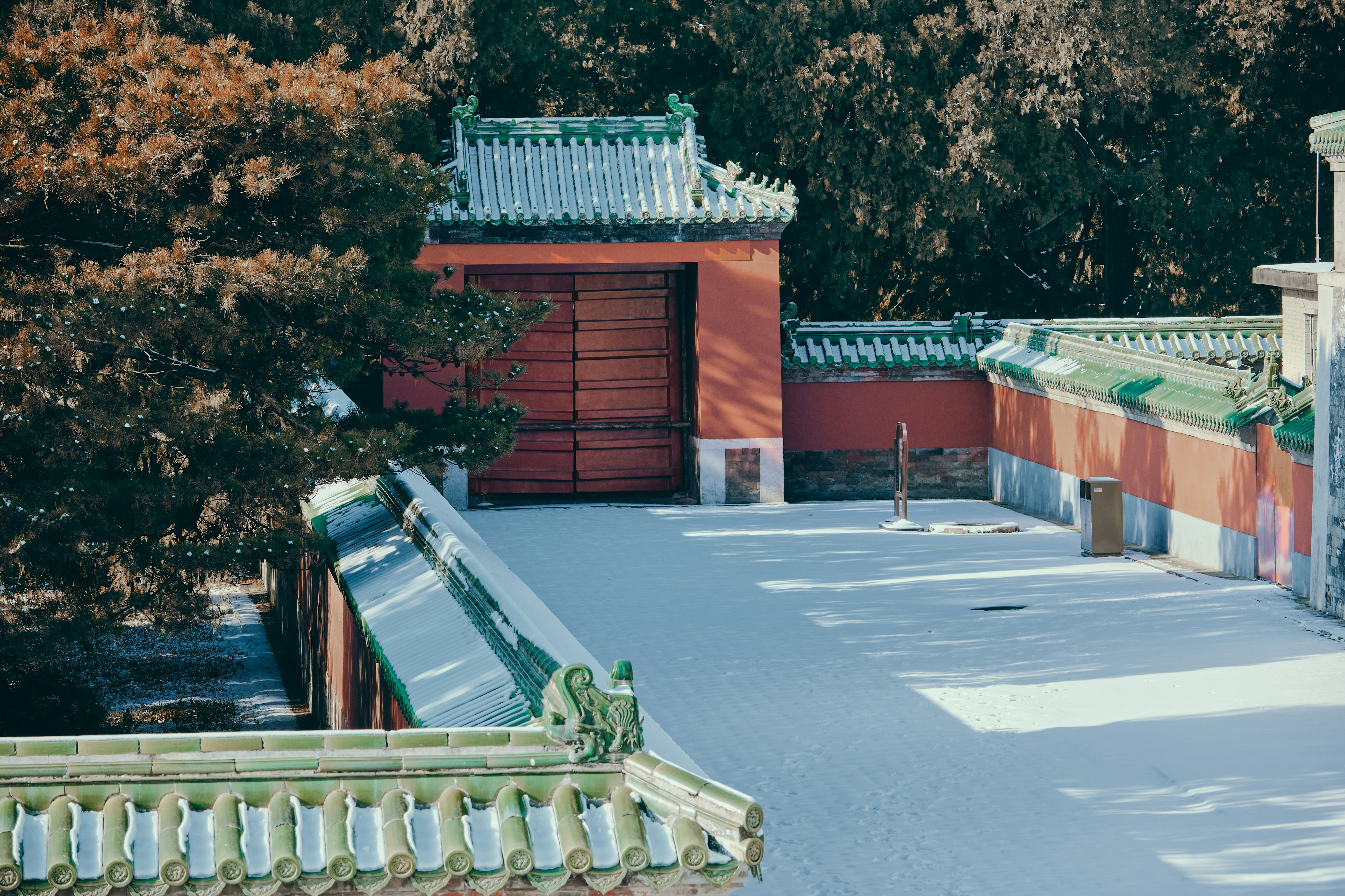 Snow-covered courtyard with traditional chinese architecture