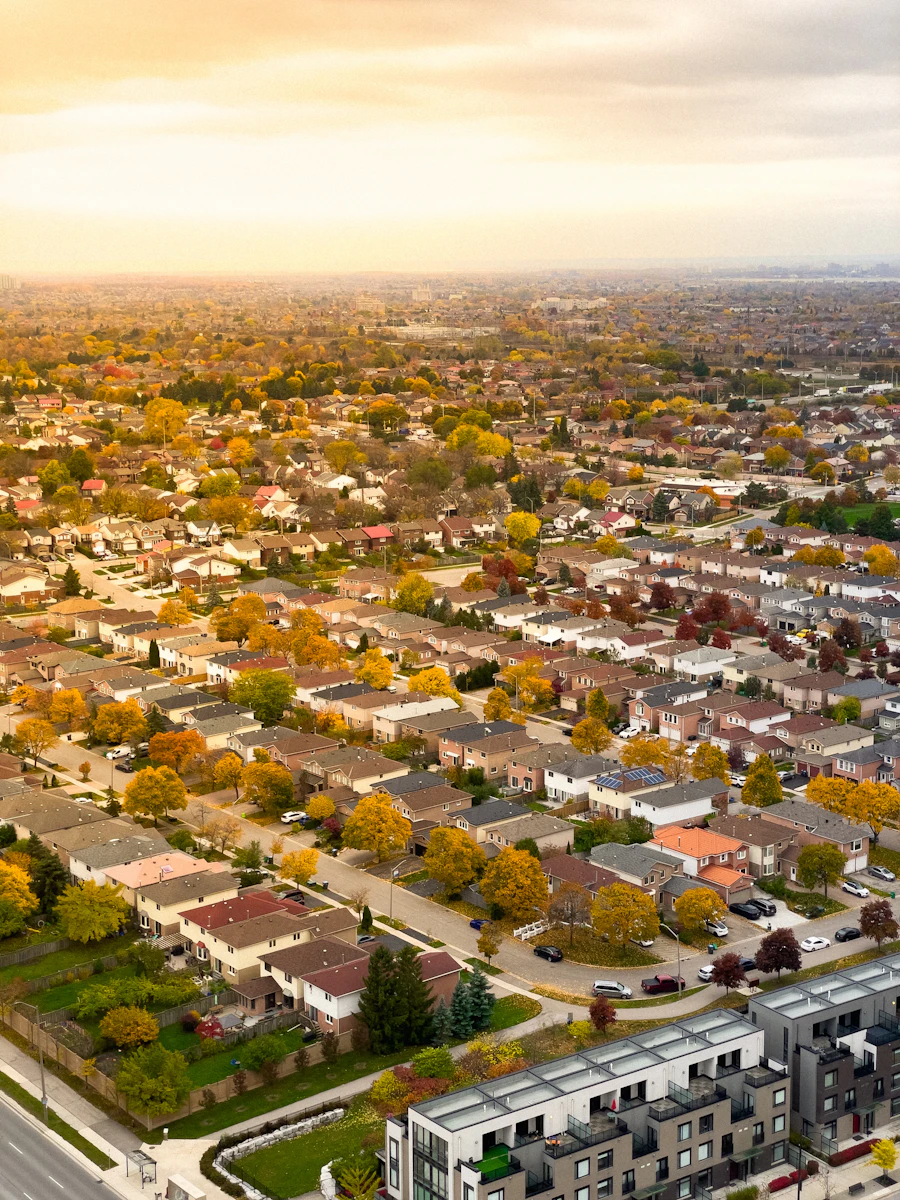 Aerial drone view of a New England neighborhood in autumn