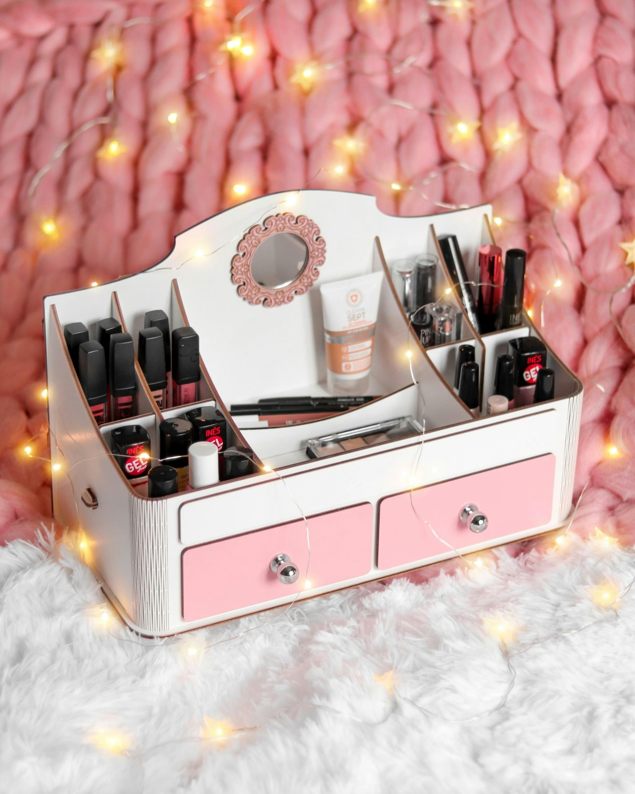 White and pink makeup organizer with cosmetics