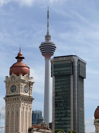Kuala lumpur skyline with historic clock tower and modern skyscrapers