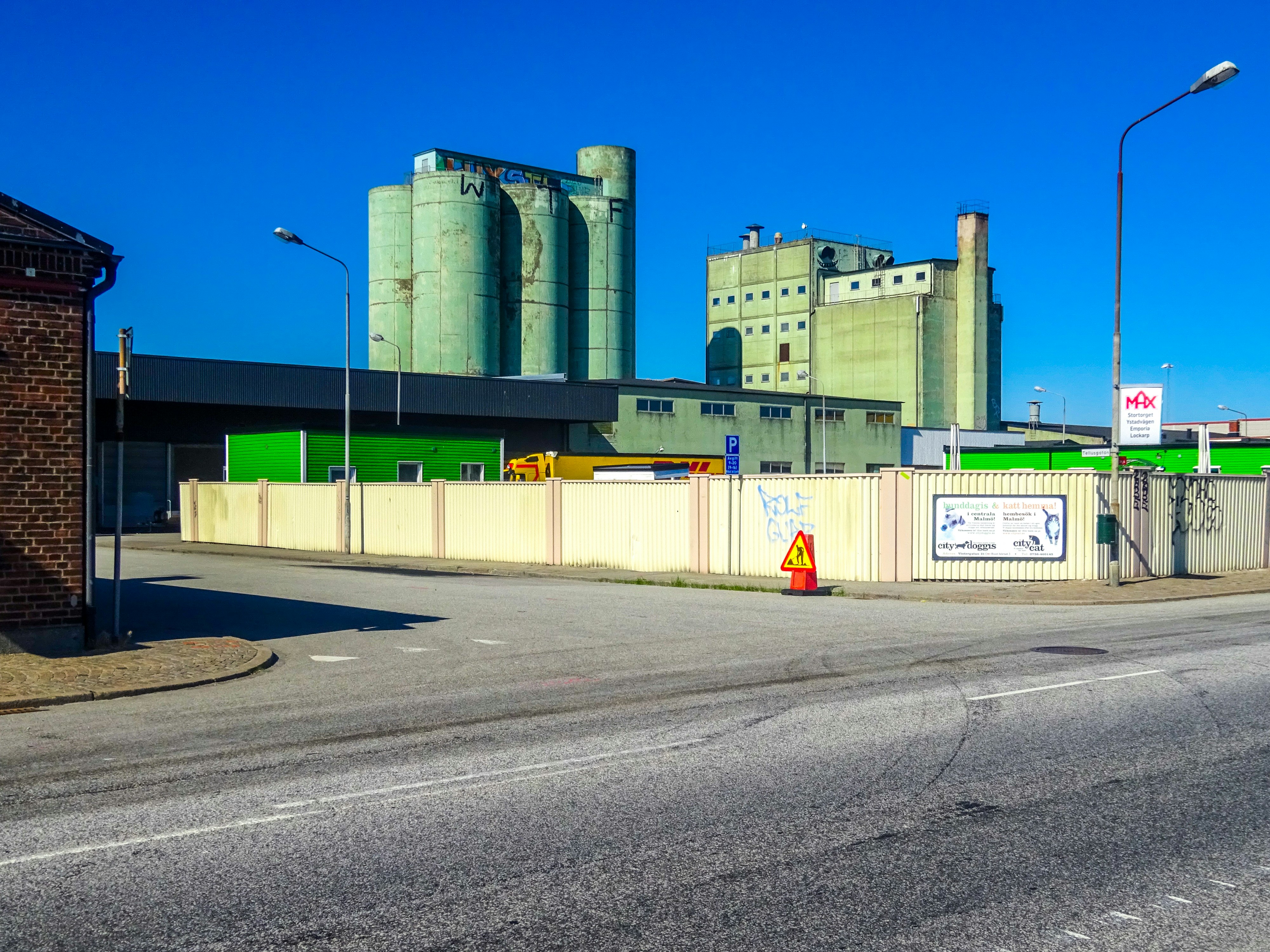Industrial buildings under a clear blue sky