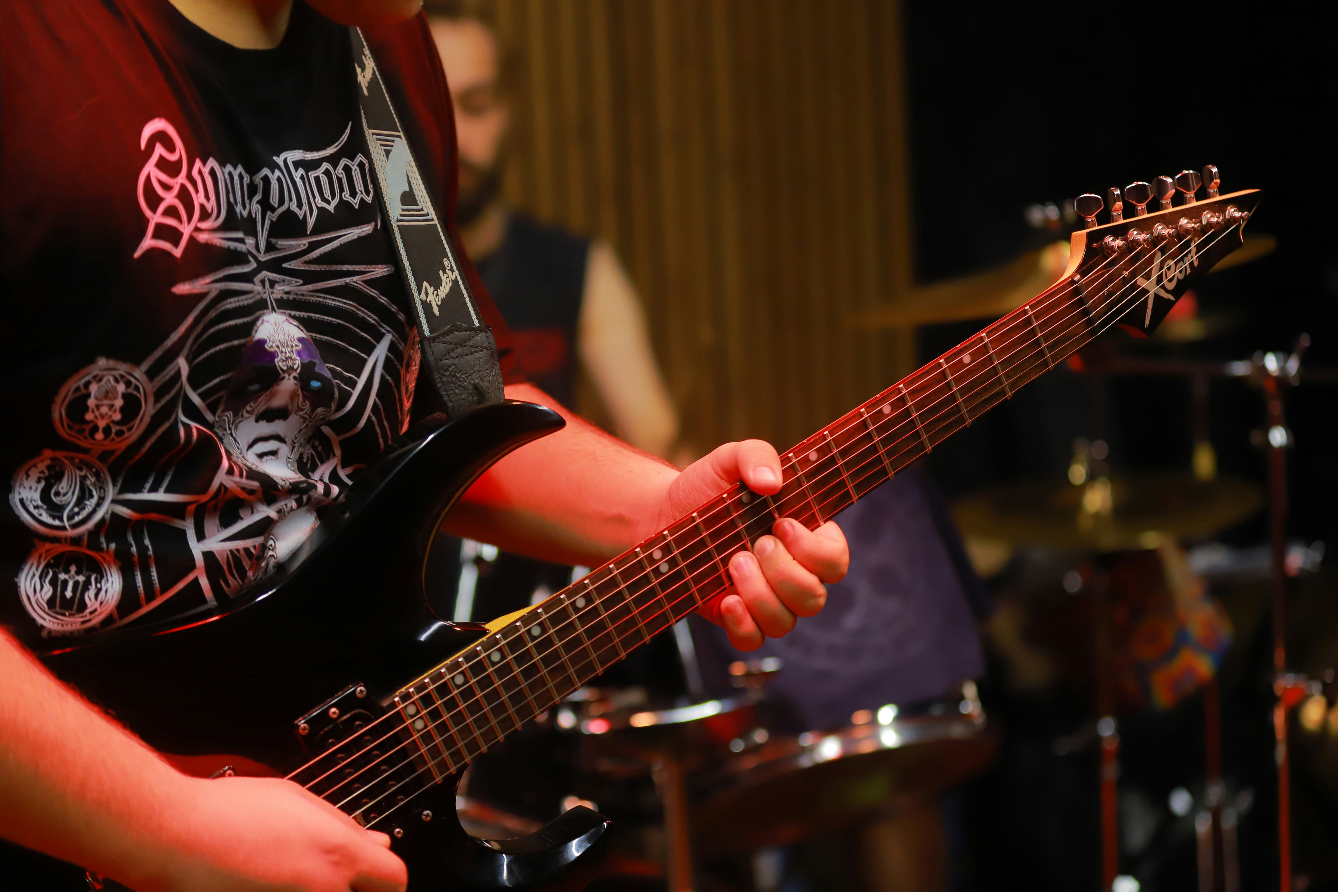 Musician playing electric guitar on stage
