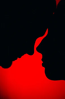 Silhouettes of two faces close together