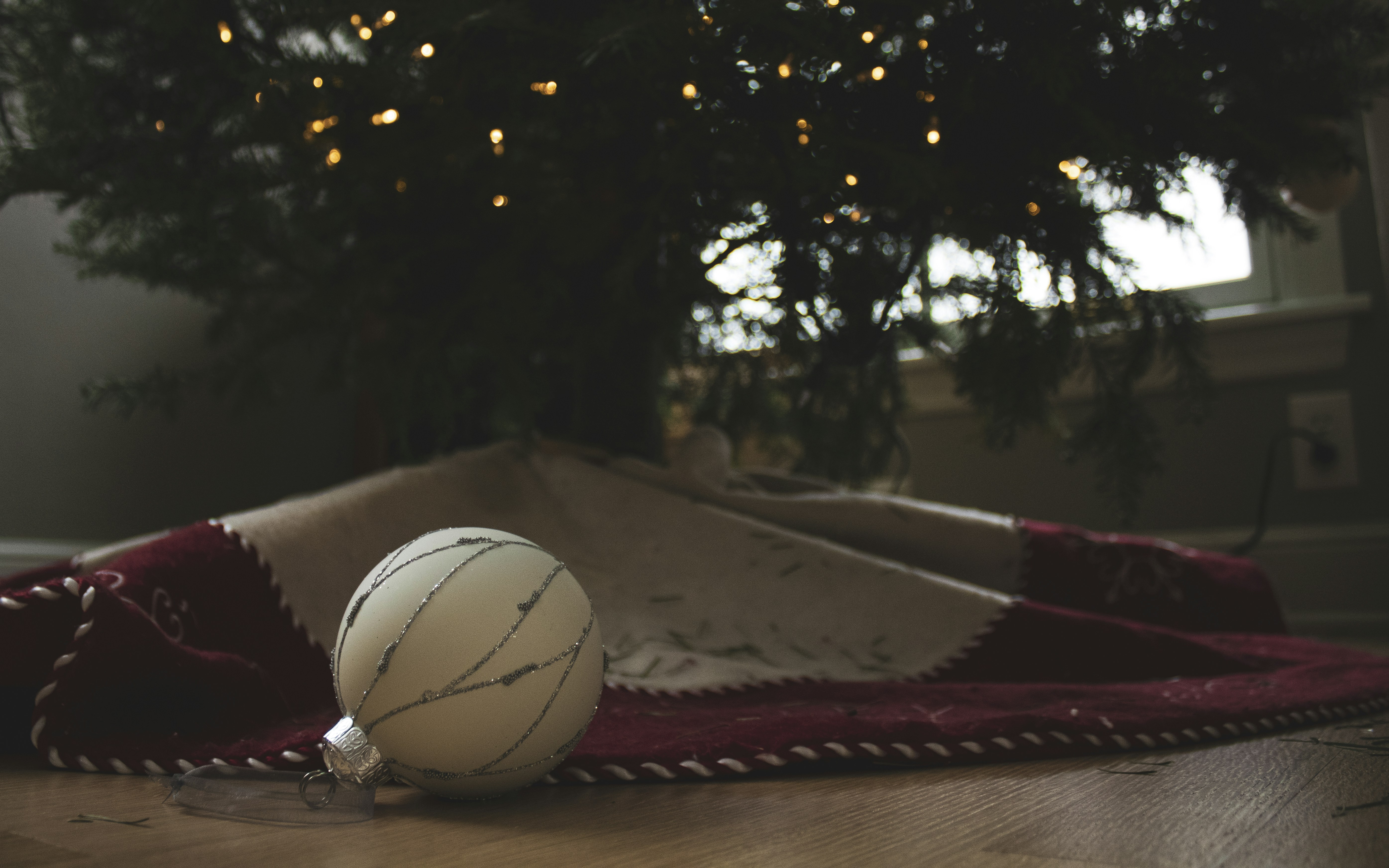 Christmas tree ornament on a festive tree skirt