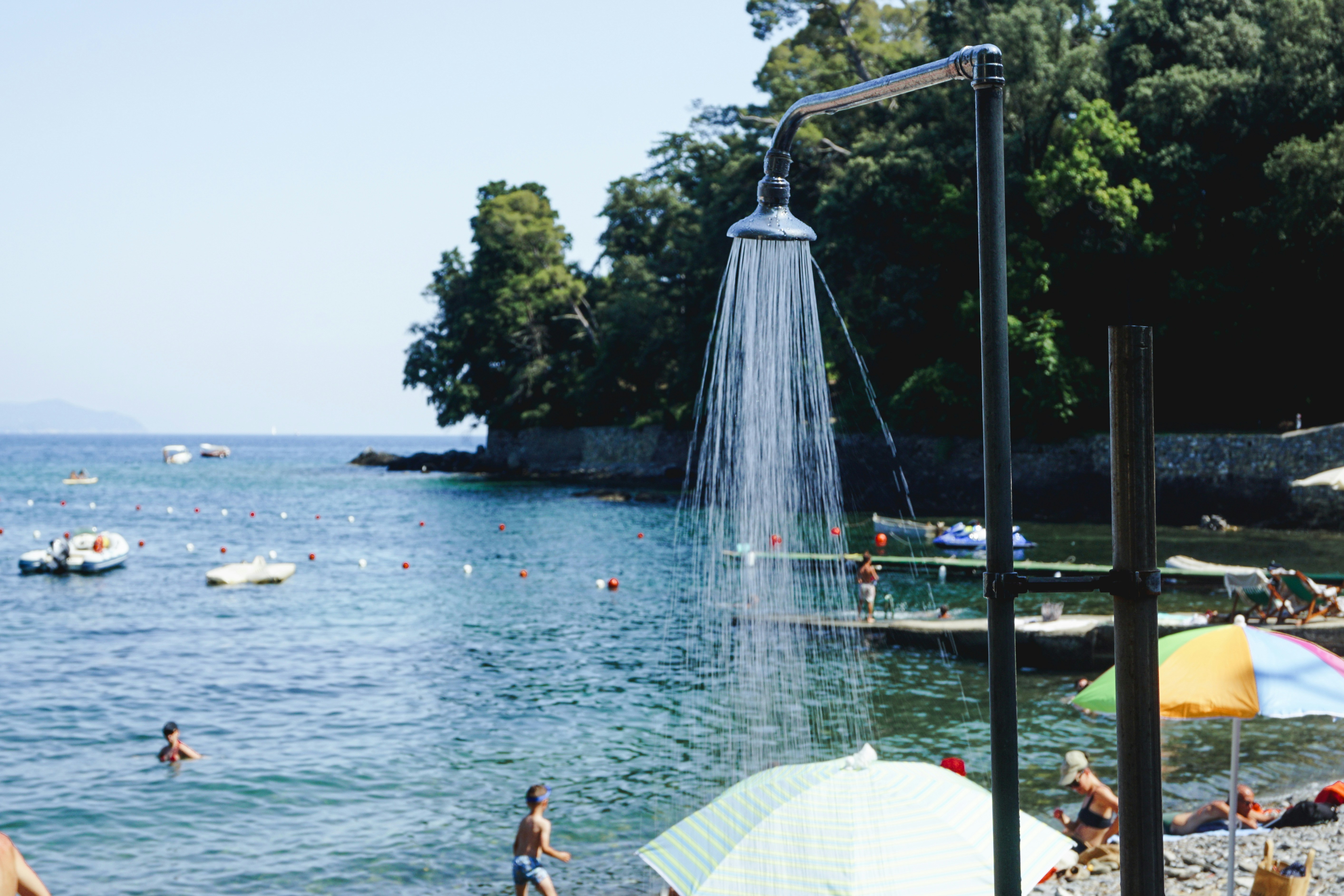 Outdoor shower spraying water by the ocean