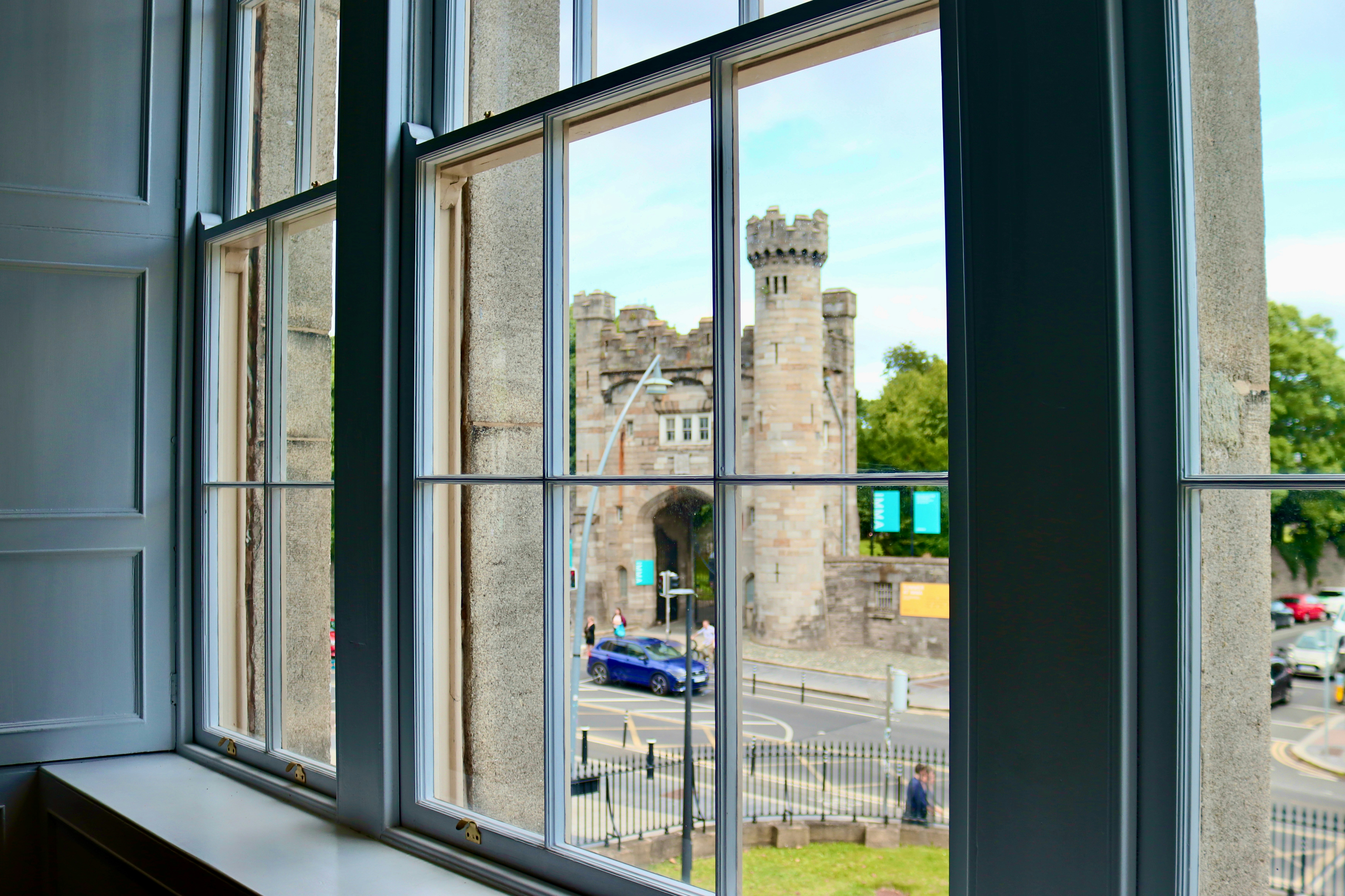 View of a castle gate through a large window